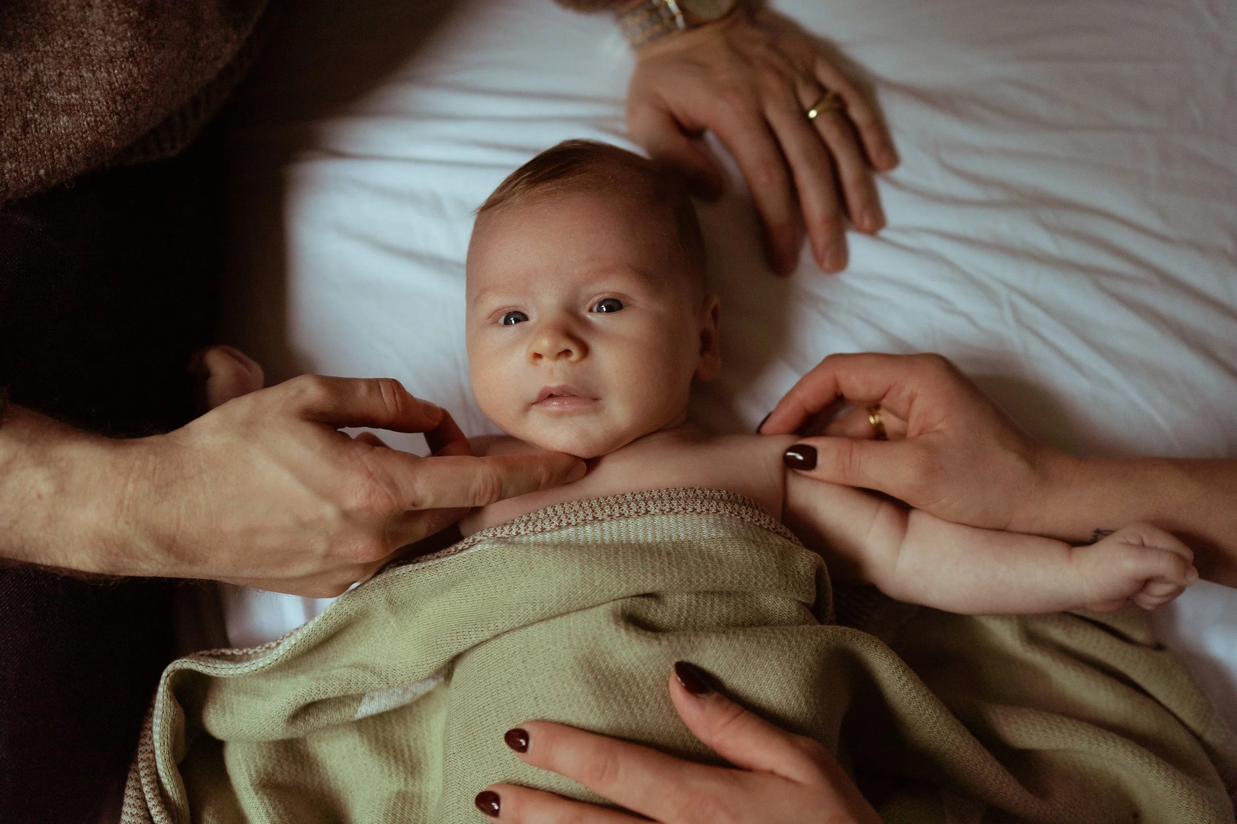 Natural family moments during an at-home newborn session