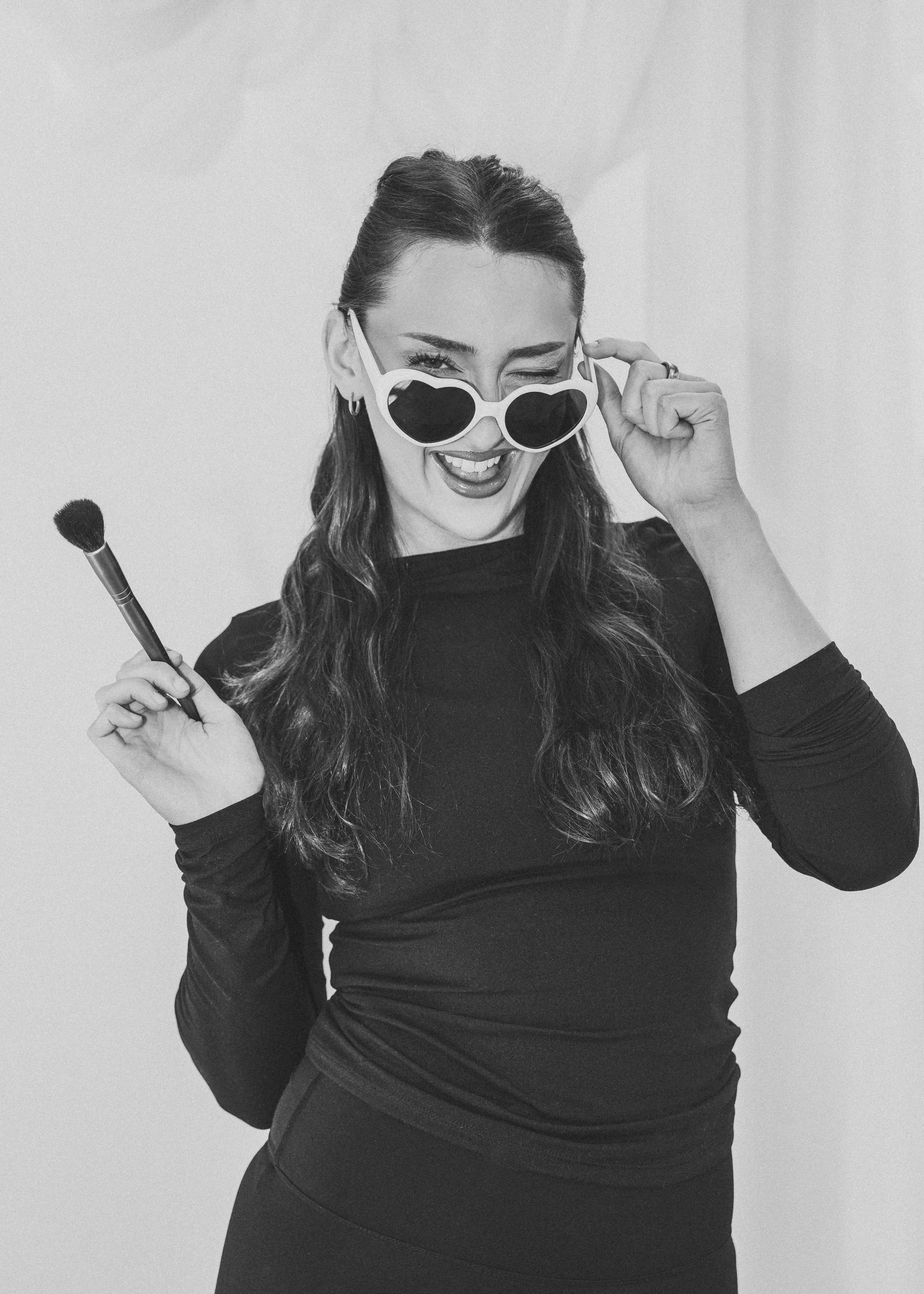 Solihull Bridal makeup Artist holding a makeup brush