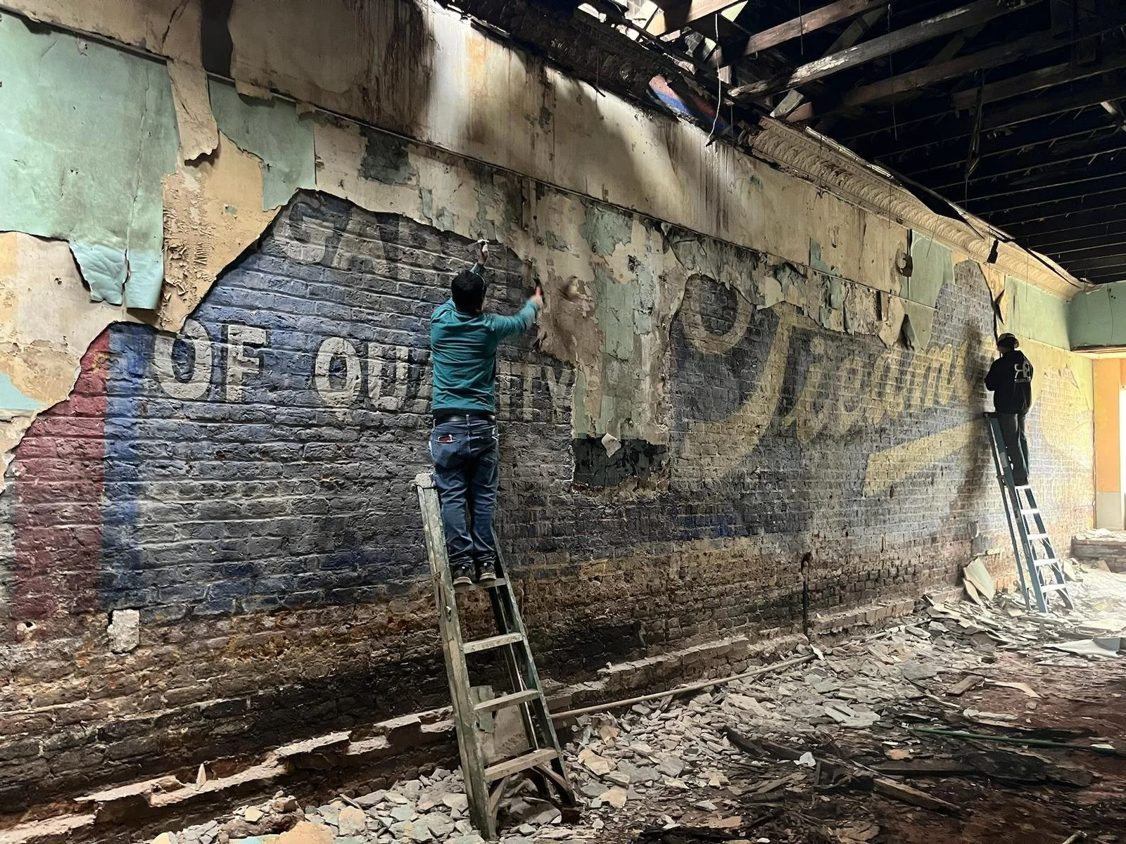 A marketing ad from the early 1900’s was uncovered from an old building in Historic Downtown Gastonia, North Carolina