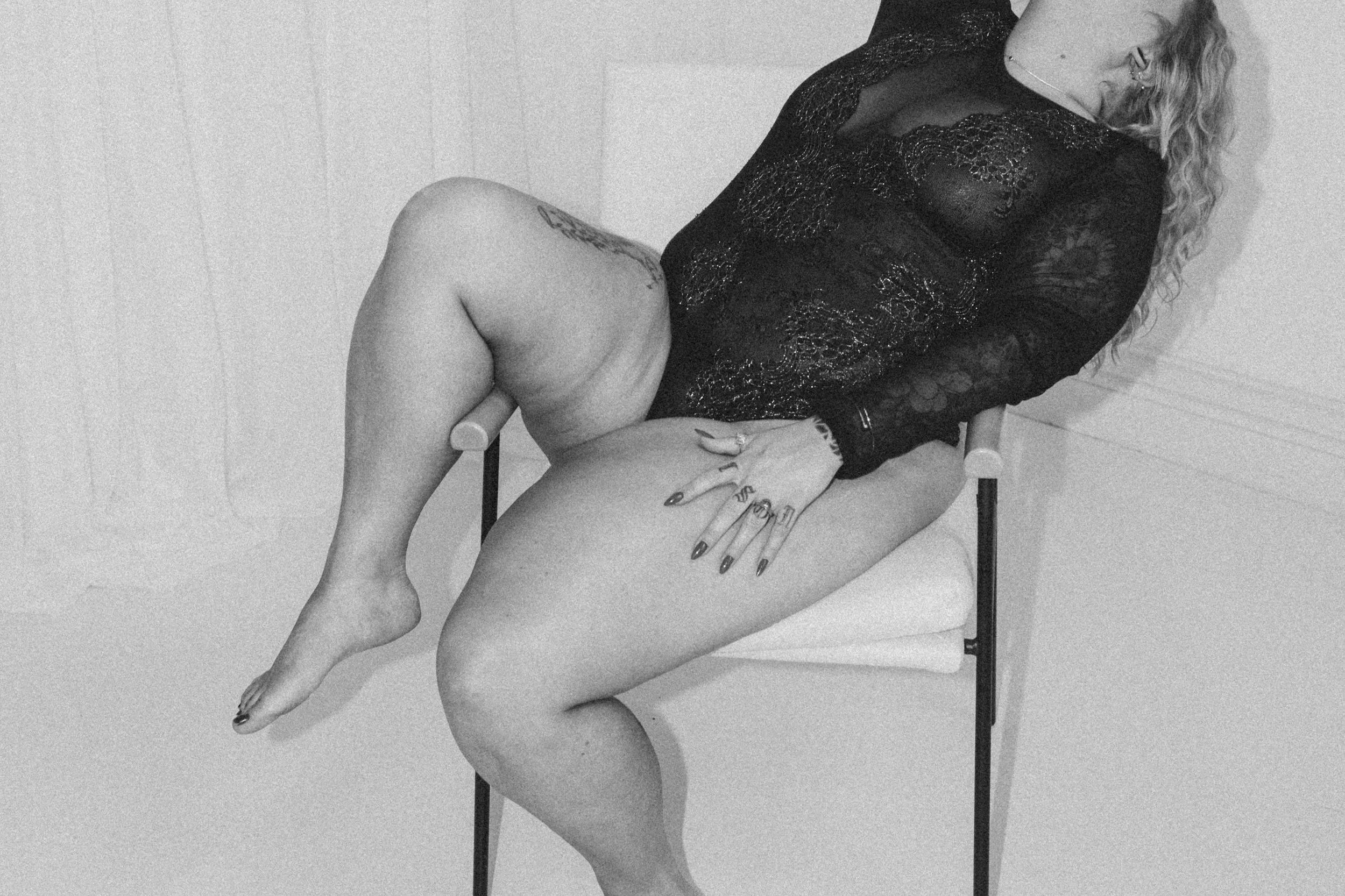 black and white image on white chair in all white room