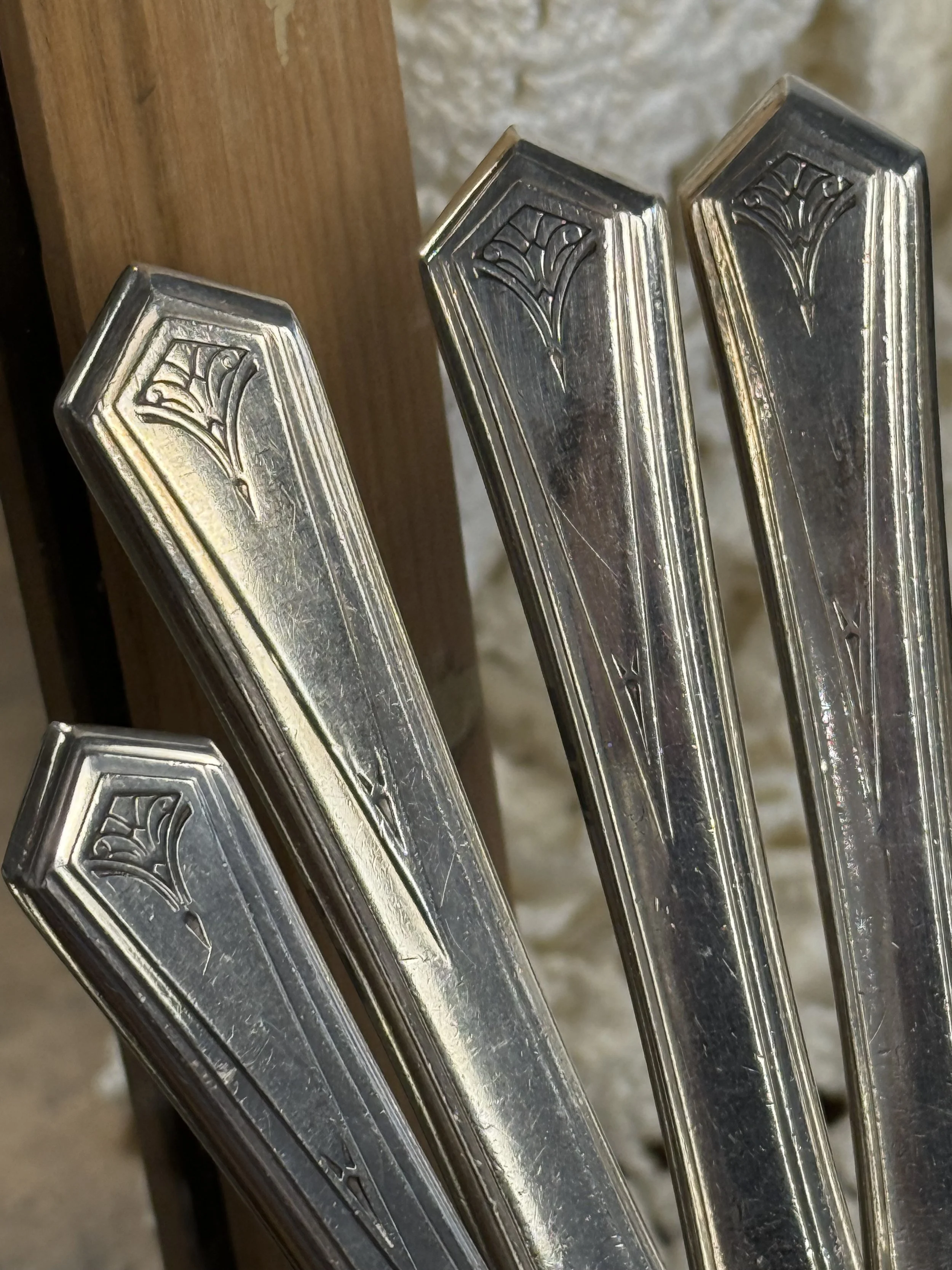 WM A Rogers Art Deco flatware handles detail, silver-plated geometric pattern close-up