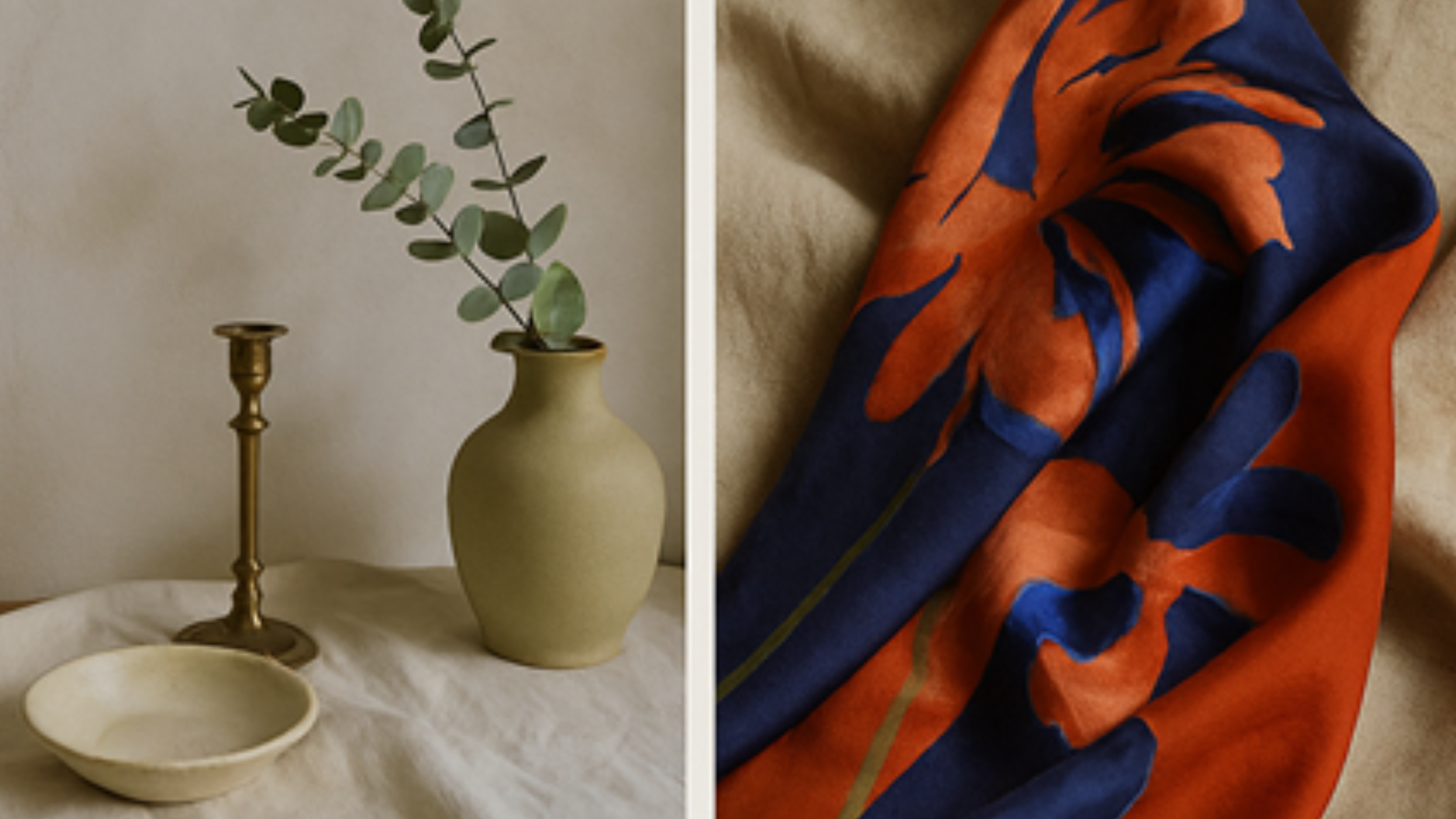A minimalistic still life of a beige ceramic vase with eucalyptus leaves on a white cloth, accompanied by a brass candlestick and a small beige dish, next to a colorful scarf with orange and blue floral patterns on a beige surface.