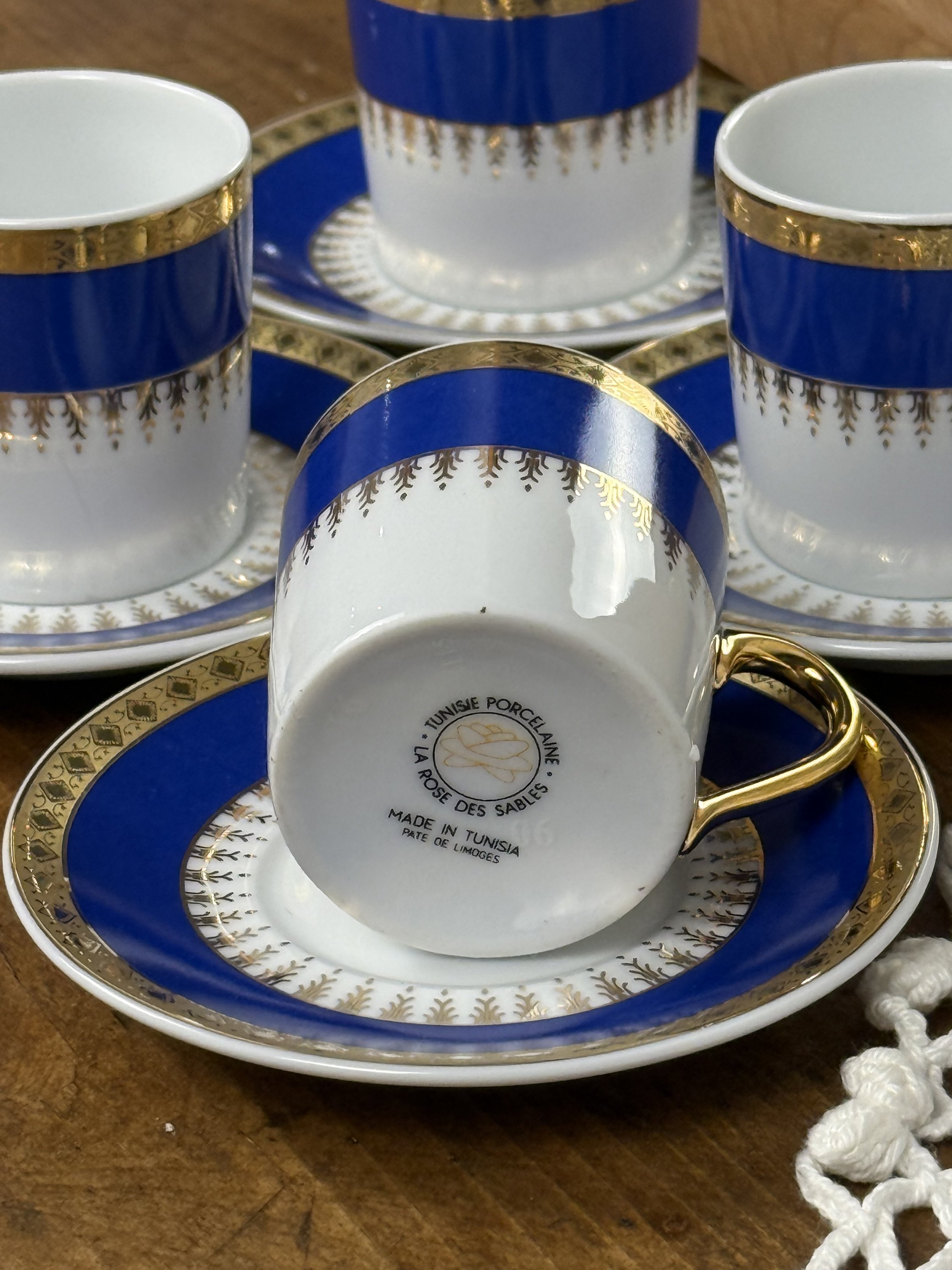 Underside of vintage espresso cup showing Tunisian Porcelaine La Rose des Sables mark, pâte de Limoges porcelain base