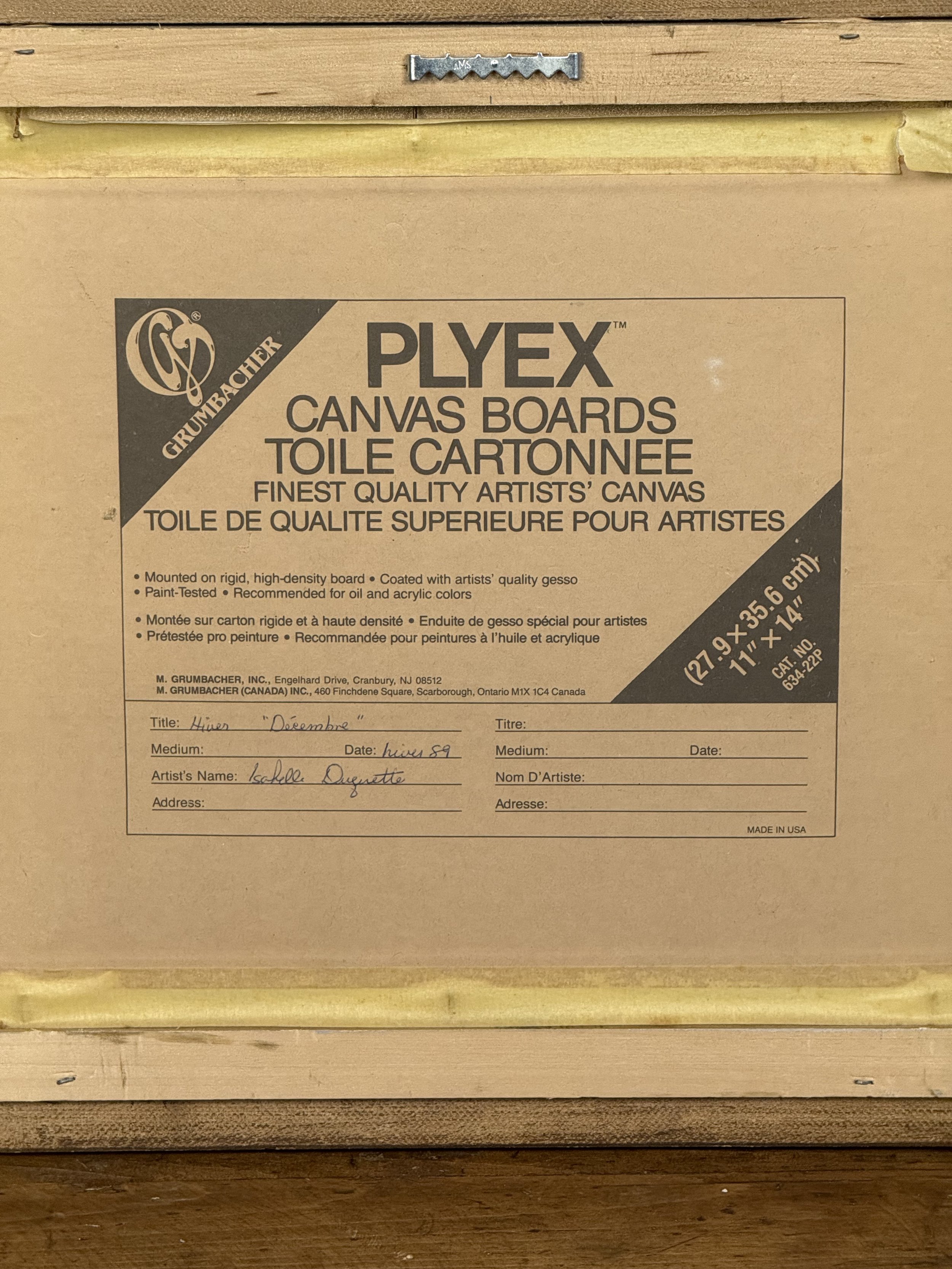 Back of framed painting showing Plyex canvas board label, dated 1989, signed Isabelle