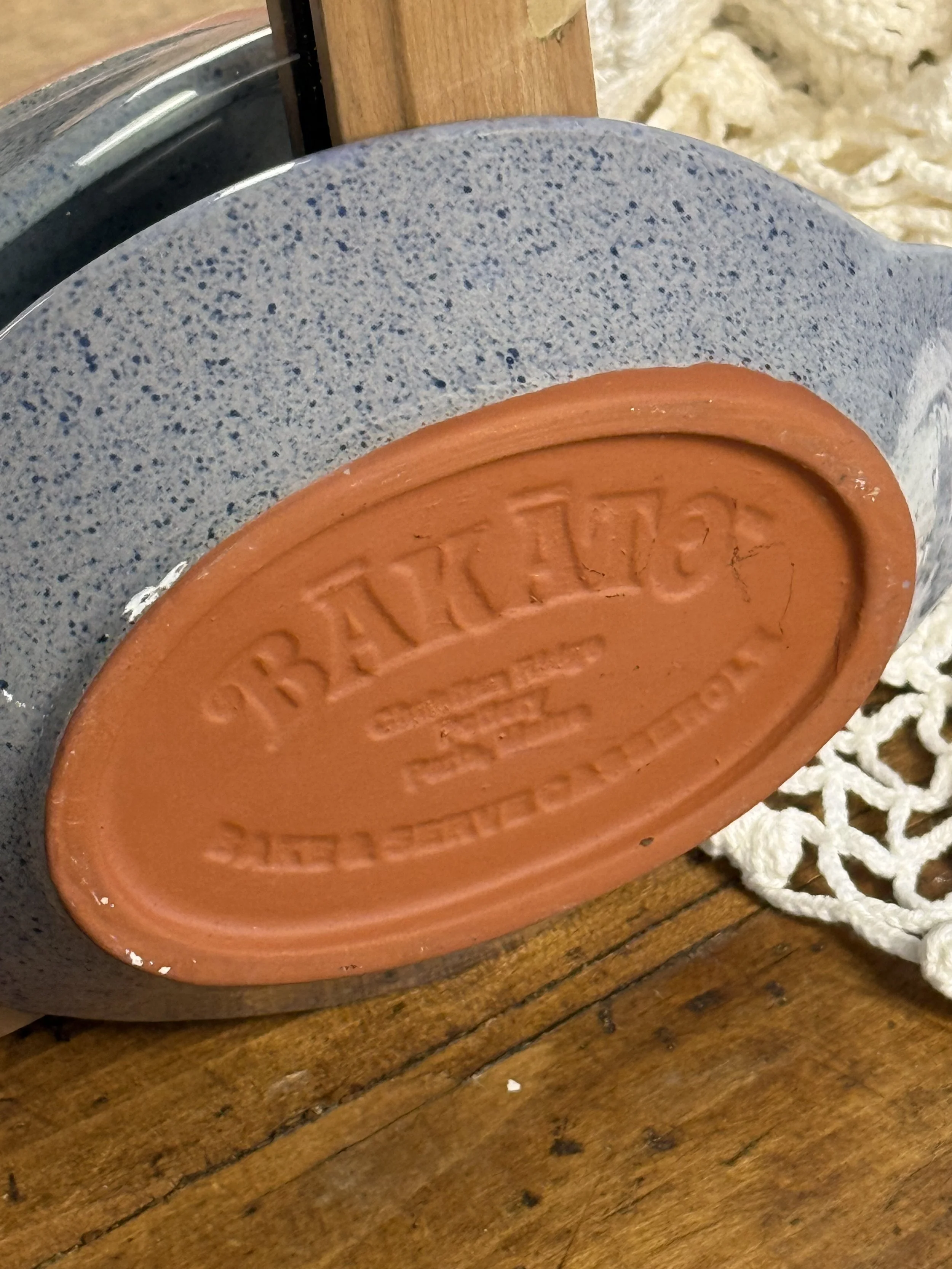 Stamped underside of Bakato bake-and-serve casserole reading Christian Ridge Pottery Paris Maine, vintage stoneware potato baker with terracotta base