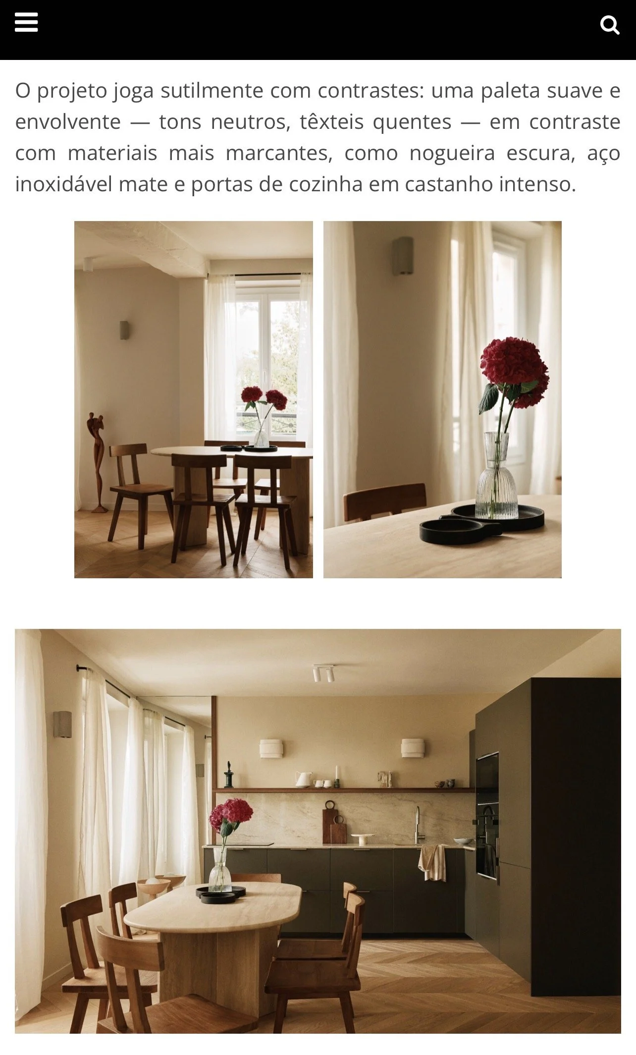 Intérieur d'une cuisine et salle à manger modernes avec mobilier en bois, murs beiges, et décor minimaliste, mettant en valeur des fleurs rouges dans un vase.