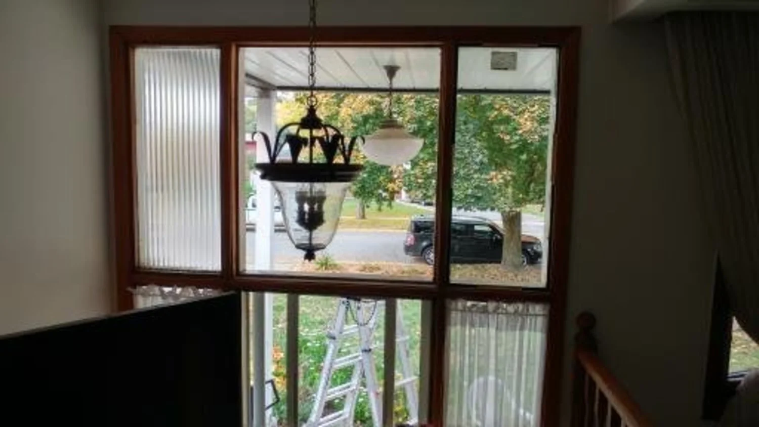 Replaced upper reeded single pane glass with clear thermal pane glass in front entrance.