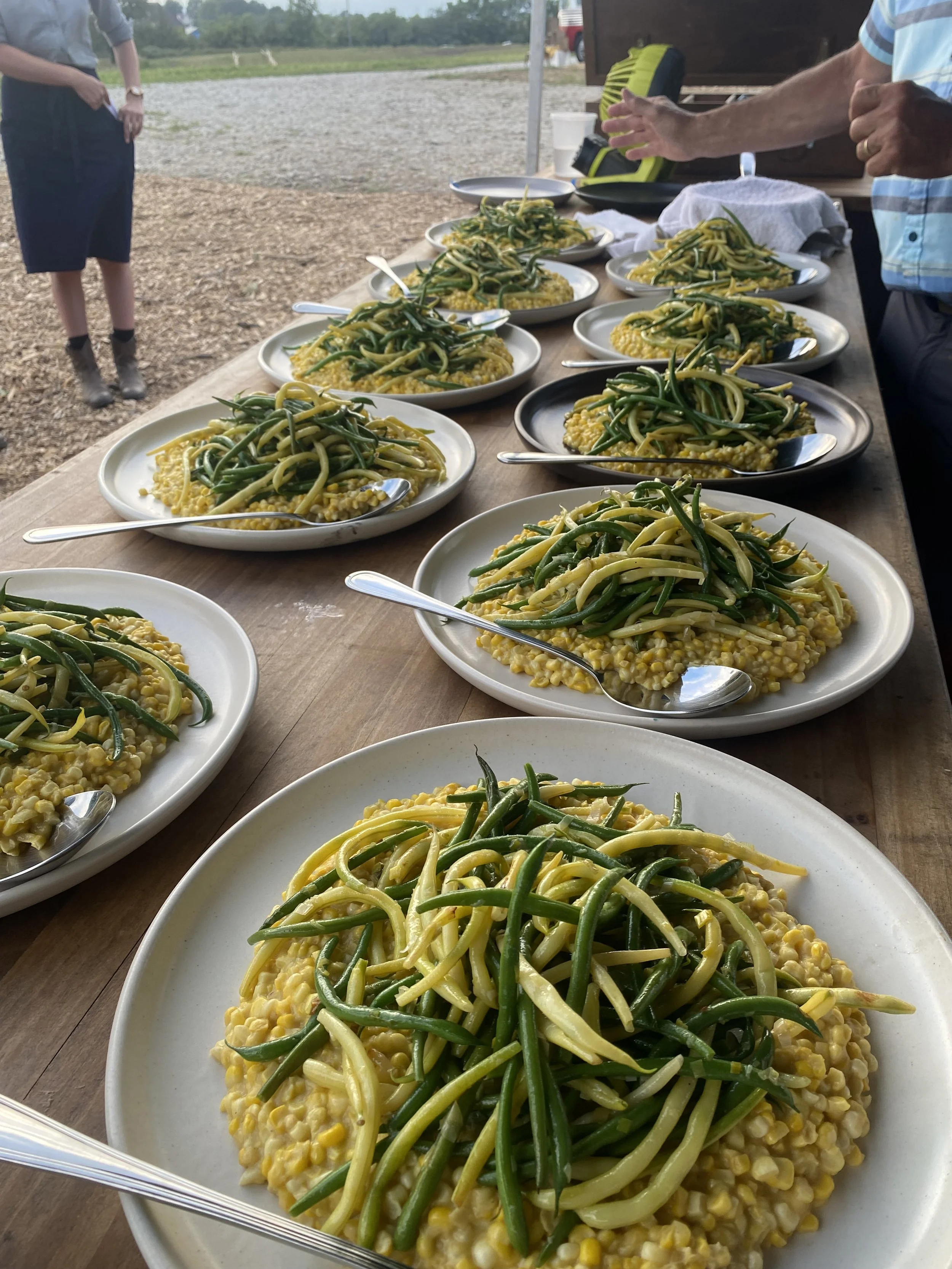 Iowa sweet corn, garden fresh green beans, wooden table, outdoor event.