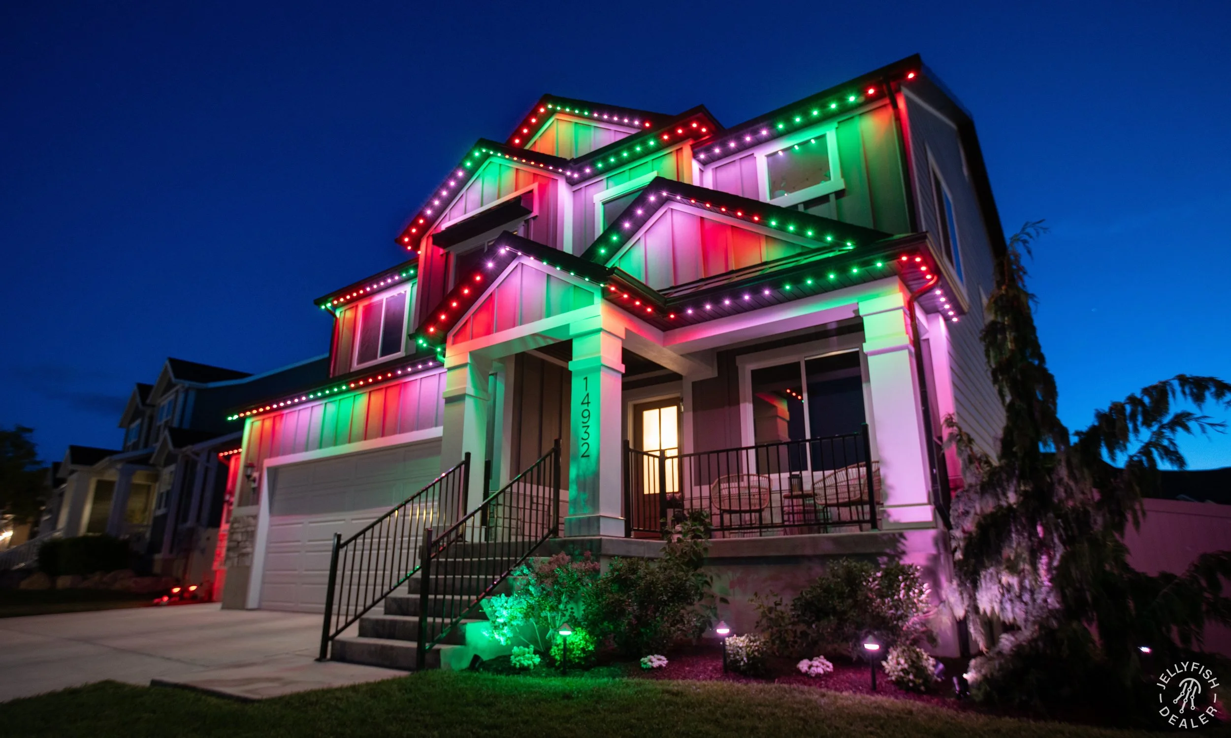 Colorful house decorated with multicolored Christmas lights at night