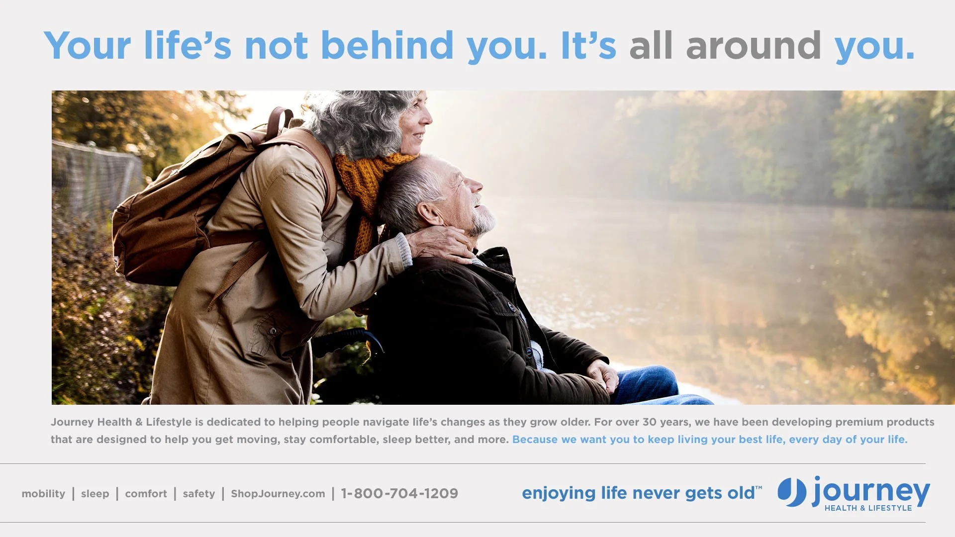 Journey Health & Lifestyle brand campaign ad for “Enjoying Life Never Gets Old” featuring an older couple embracing outdoors by a lake with headline “Your life’s not behind you. It’s all around you.”