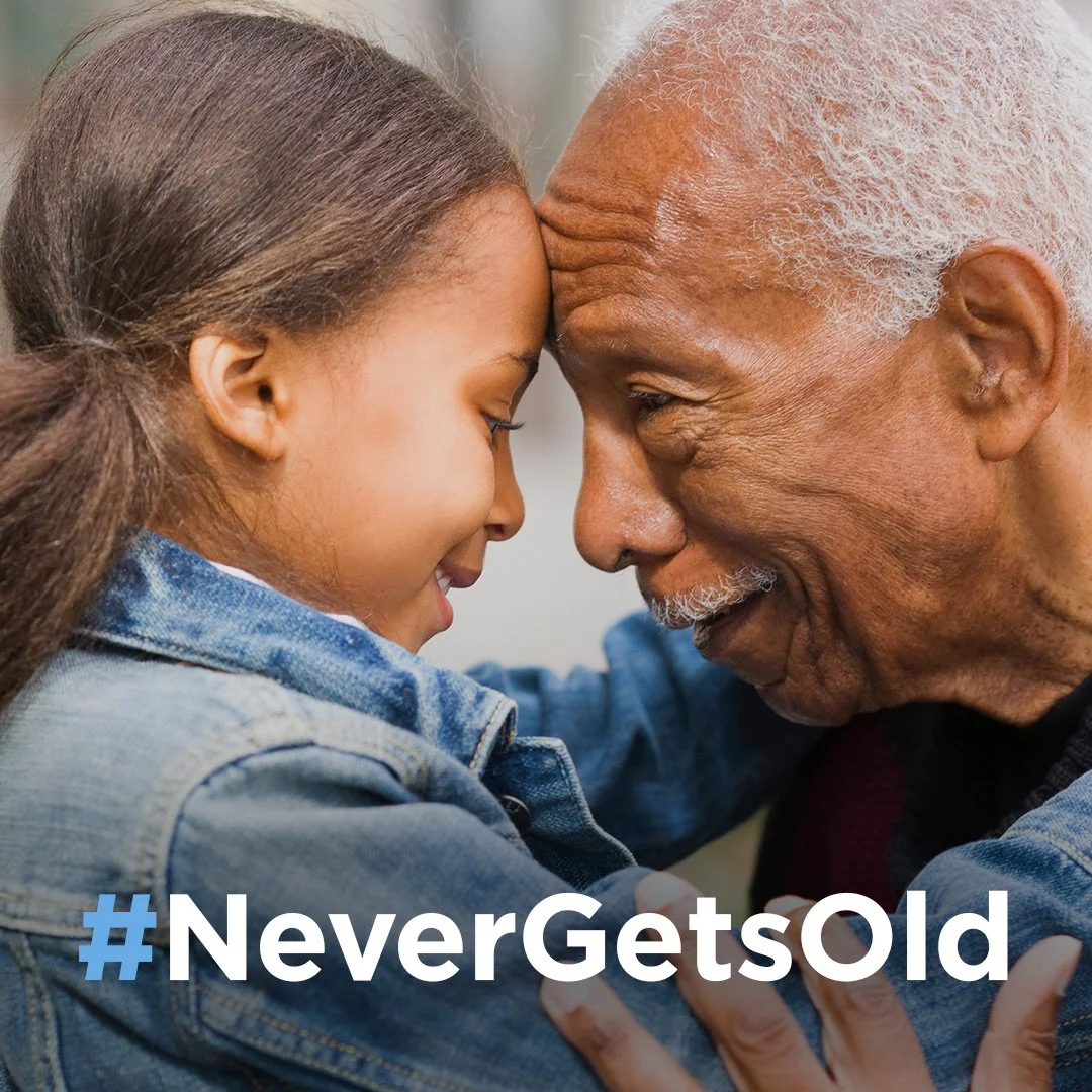 Journey Health & Lifestyle hero image for “Never Gets Old” brand transformation campaign featuring a warm, real-life moment between a young girl and her grandfather to highlight connection, comfort, and purpose in aging.