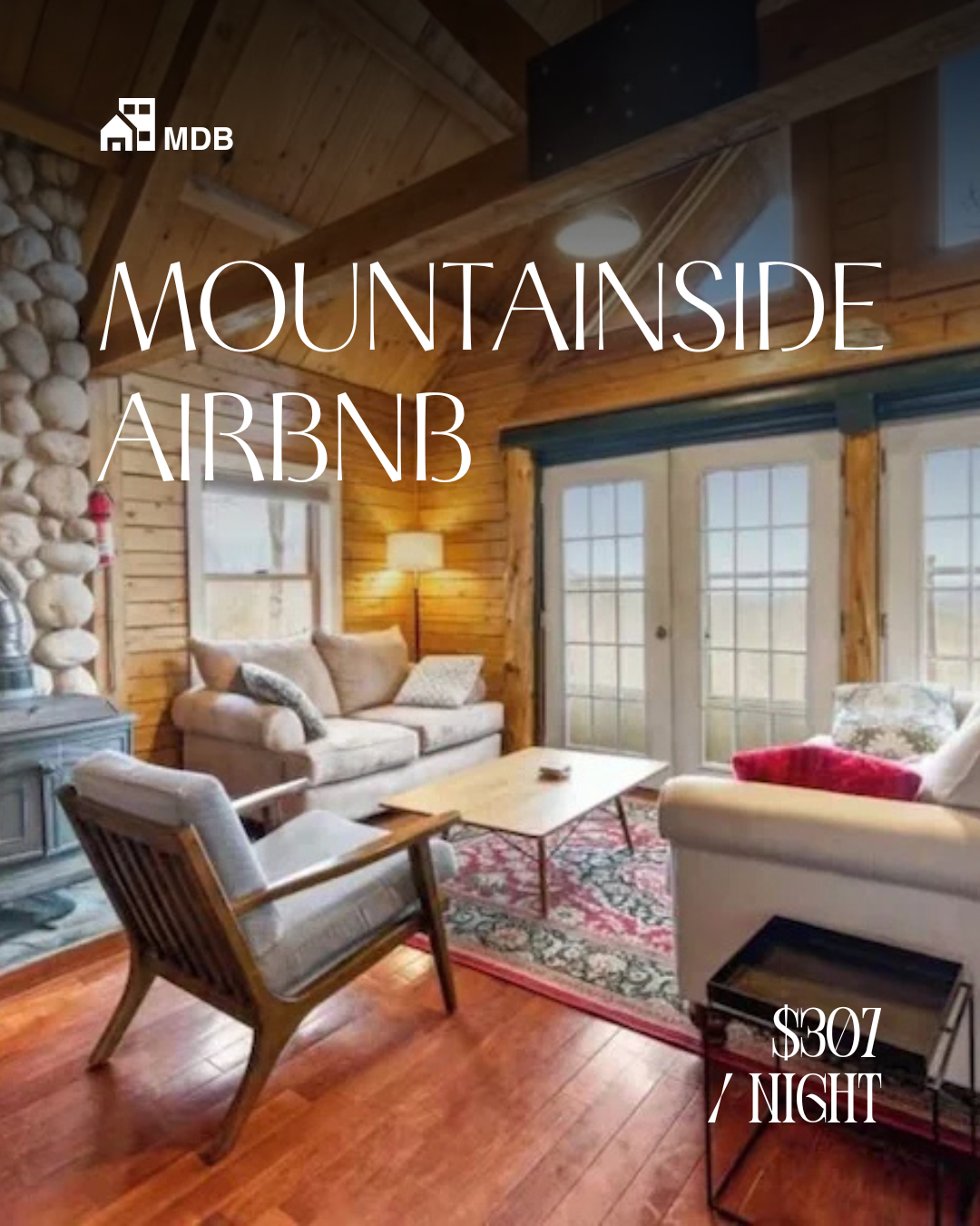 Cozy cabin living room with wood walls and ceiling, large windows, and comfortable furniture including a sofa, armchair, and a rug, illuminated by natural light and a floor lamp.
