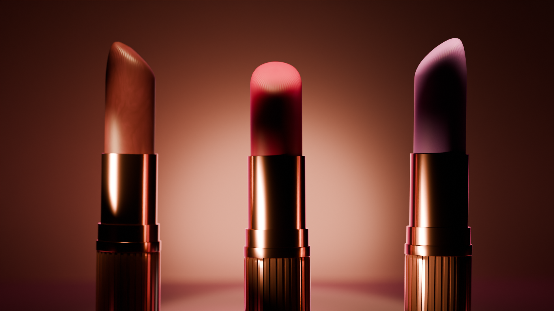 Three lipsticks in metallic tubes with different shades, illuminated against a warm brown background.