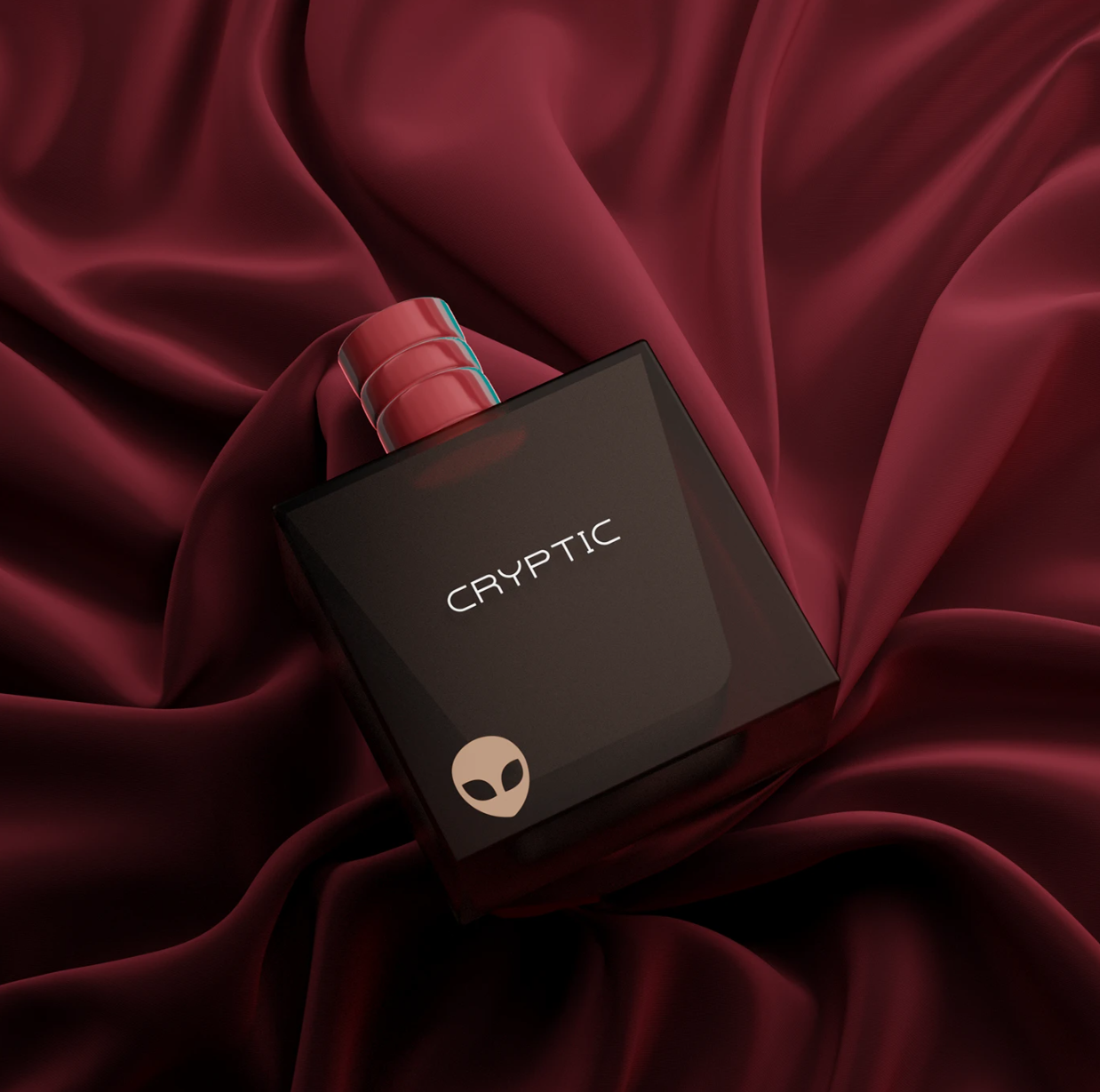 A black box with the word 'CRYPTIC' and a small alien face logo on it, placed on dark red silky fabric.