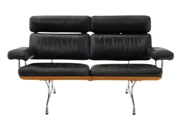 A modern black leather sofa with metal legs and armrests.