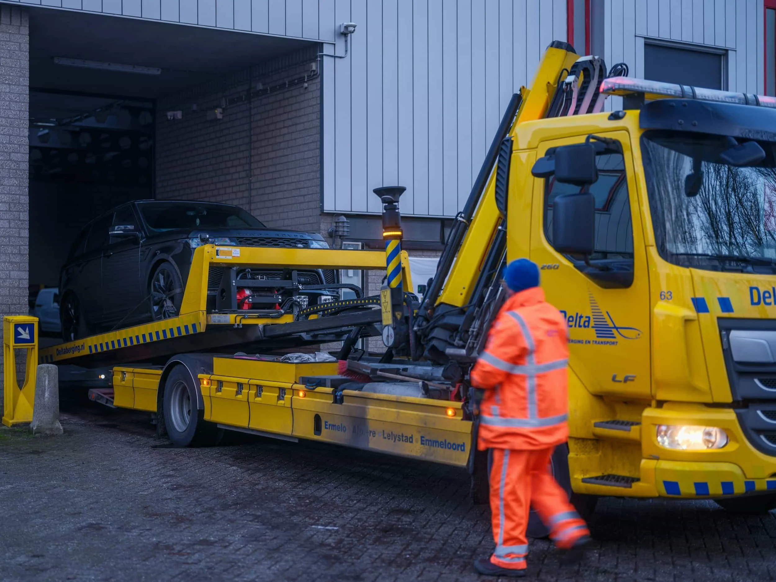 a car being recovered on a truck