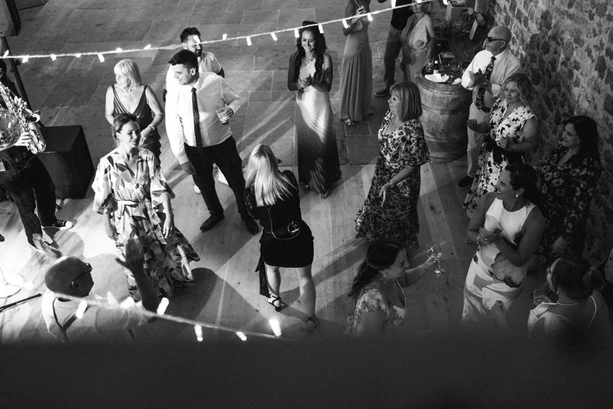 Guests dancing to live wedding band entertainment at Tithe Barn Symondsbury Dorset during a lively barn reception