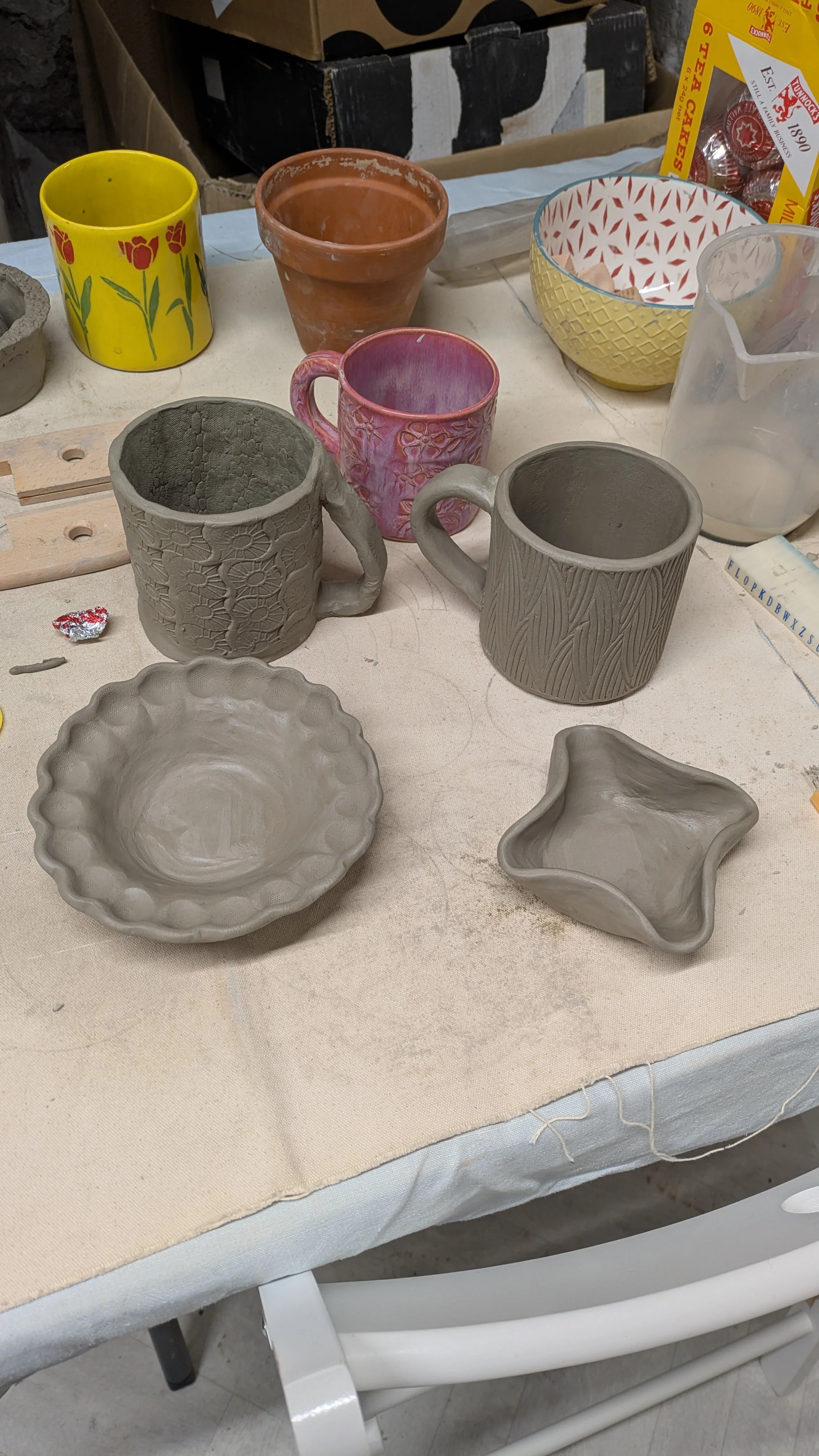 Work in progress of stoneware clay mugs and pots made in pottery class Sheffield