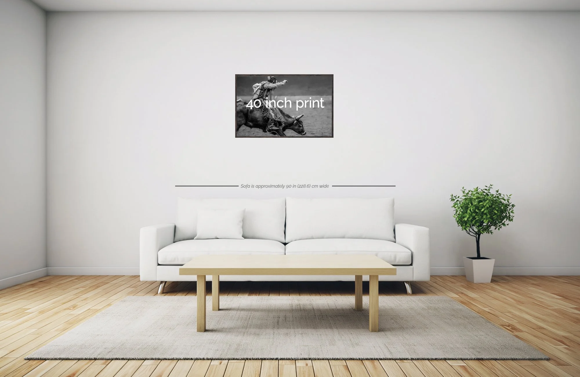 Living room with a white couch, beige coffee table, and a potted plant on the right. A black and white artwork hangs on the wall above the couch, and a line of text indicates the couch is approximately 90 inches wide.