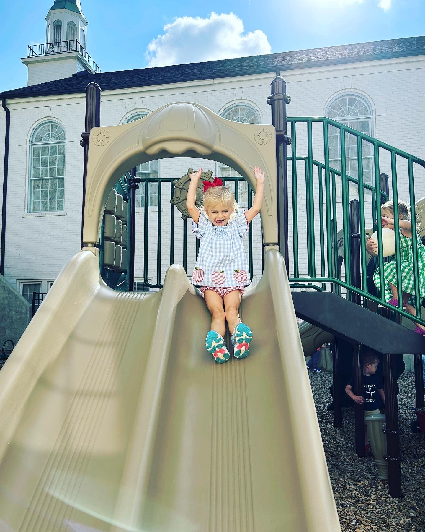 girl-going-down-slide.JPG