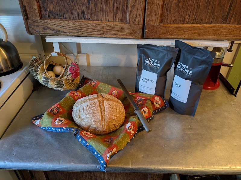 Freshly baked bread, eggs, and artisan coffee on kitchen counter at Herdsman House artist retreat and guest house