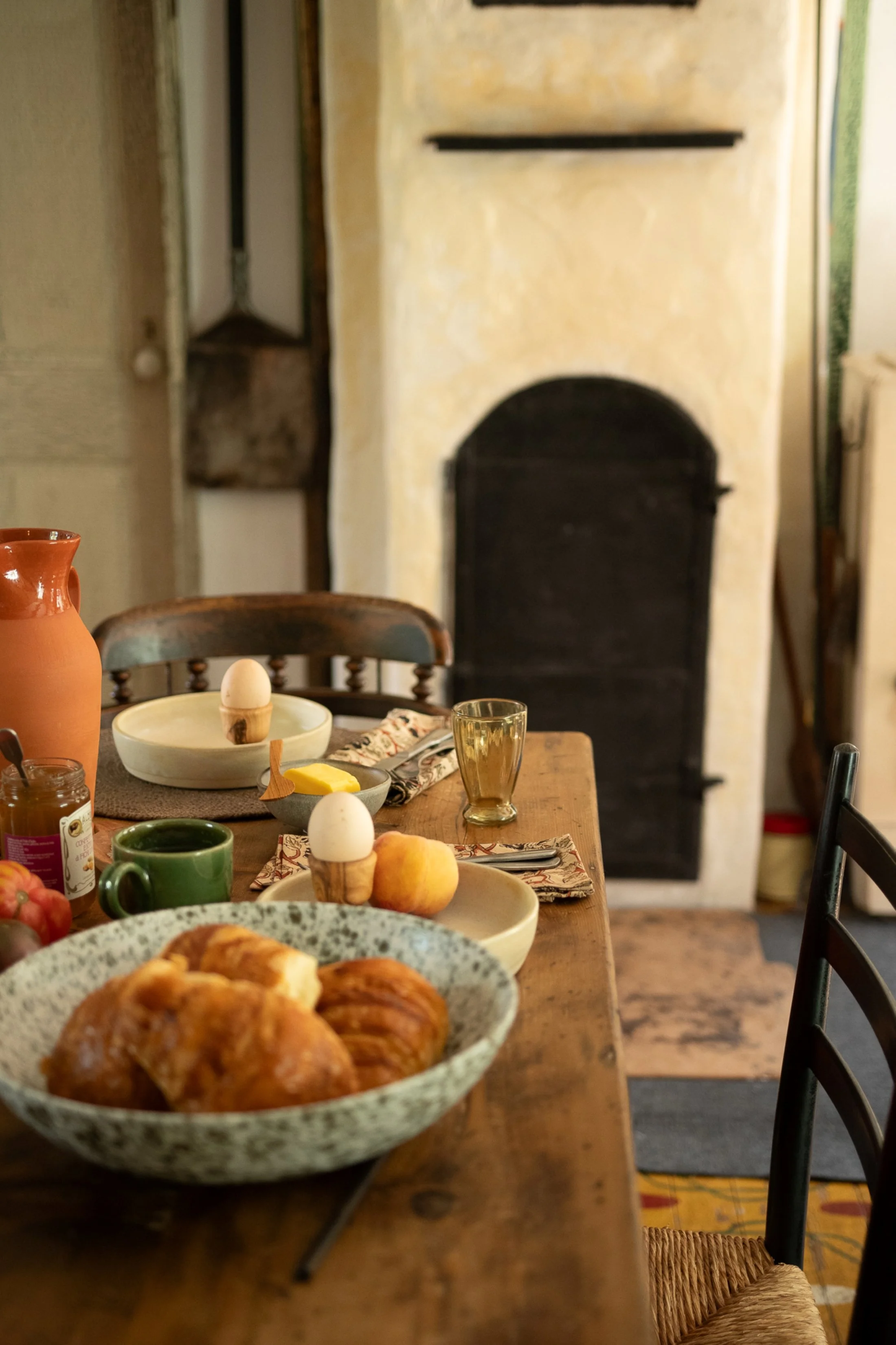 Warm morning scene with fresh pastries and soft-boiled eggs, reflecting the lived-in charm of Herdsman House’s history — photo by June Home Supply
