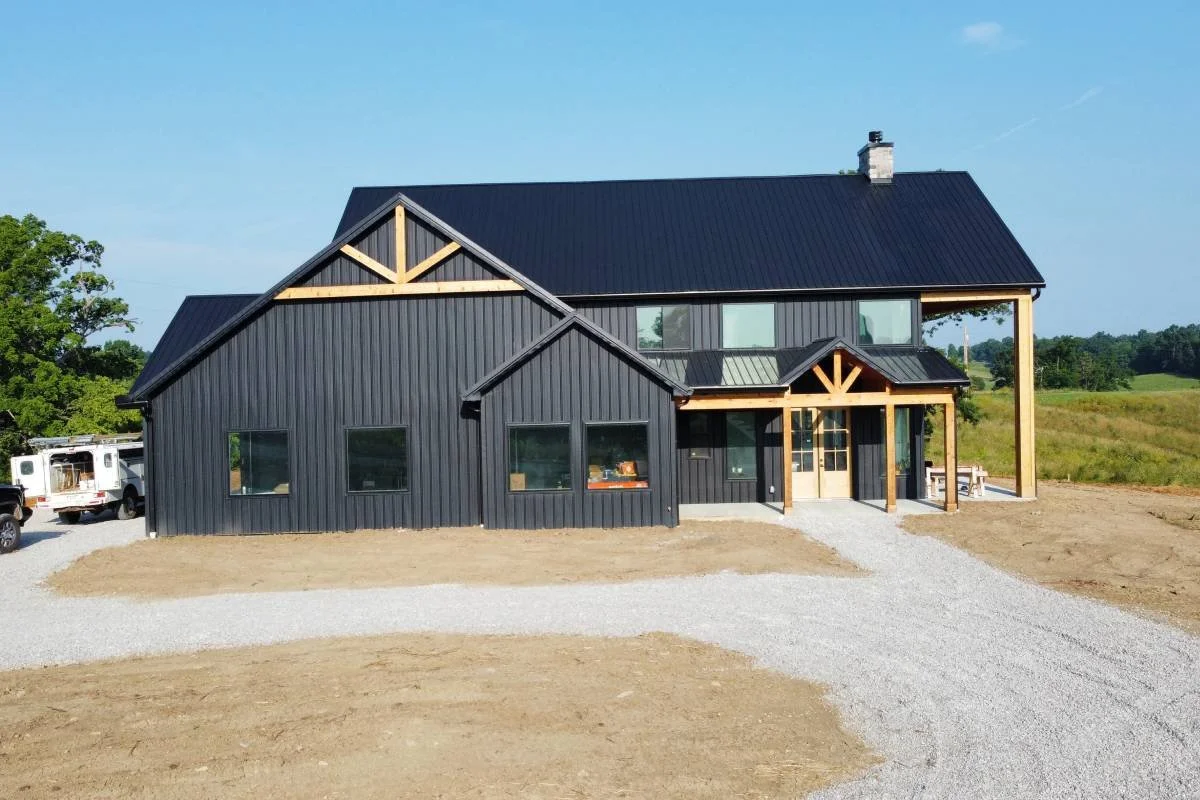 Modern black custom barndominium in Kentucky.