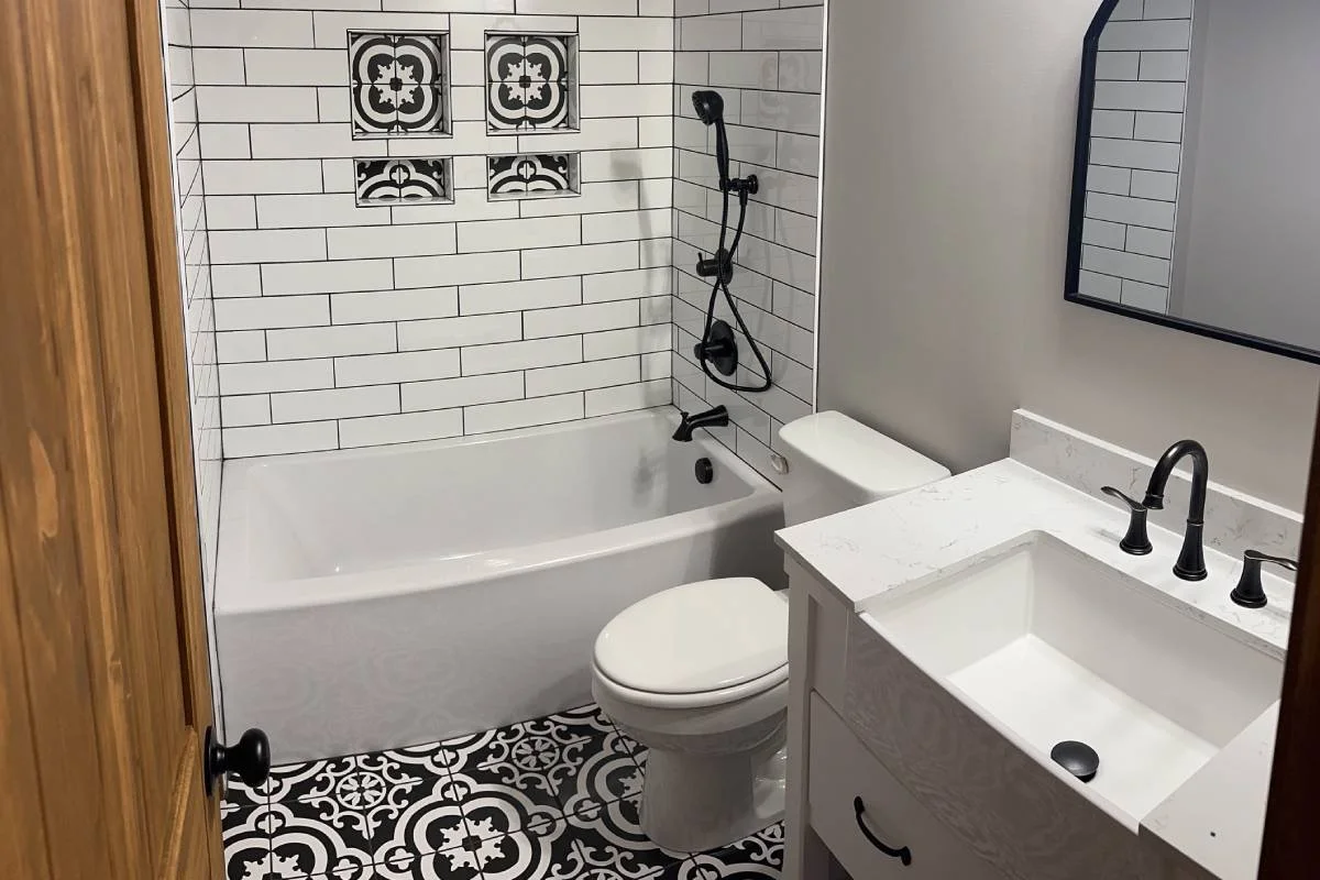 Recently Constructed New Luxury Bathroom with a Tub, Vanity, and Modern Fixtures