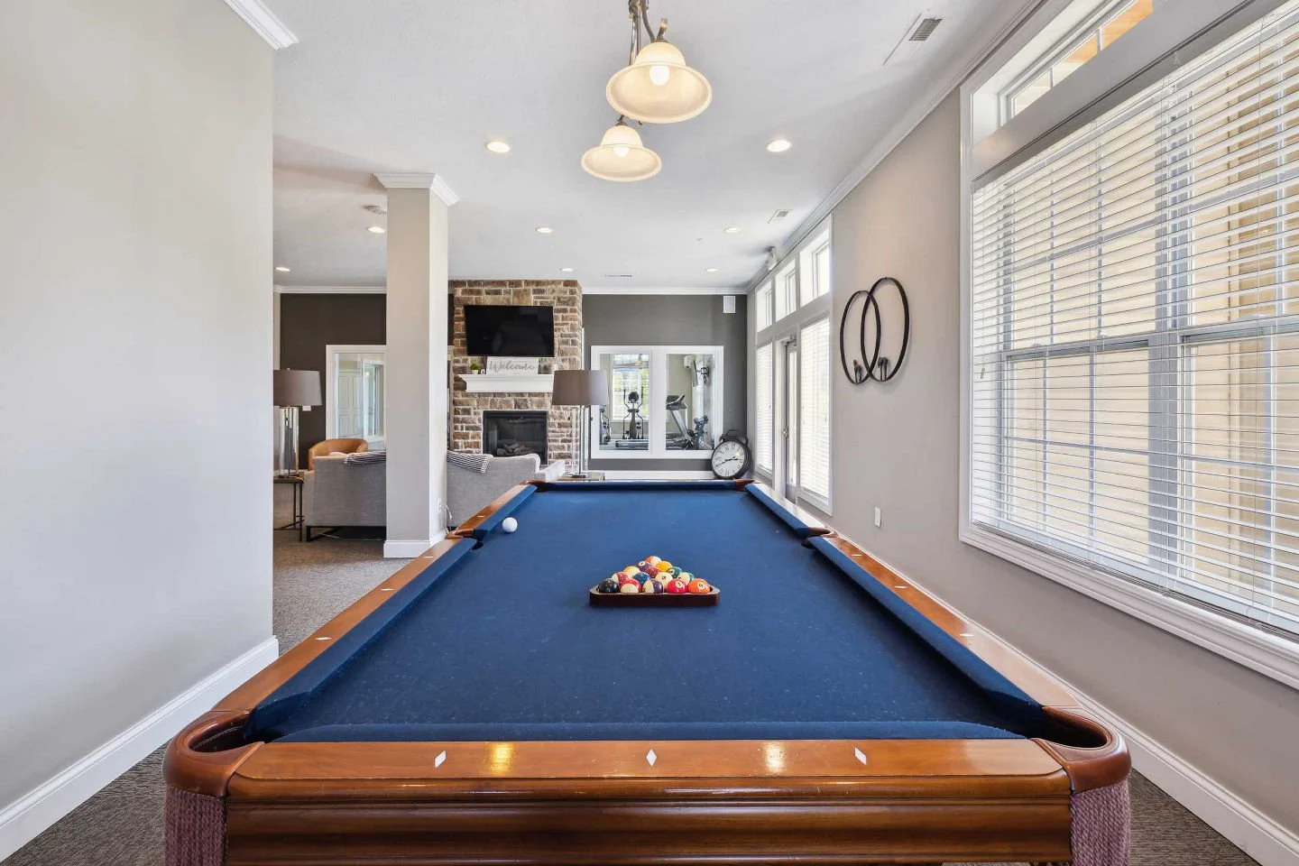 Game on! 🎱 Whether you're challenging friends to a round of billiards or simply unwinding after a long day, the clubhouse game room is the perfect place to relax, connect, and have some fun.	#ClubhouseLife #GameRoom #CommunityAmenities #ApartmentLiv