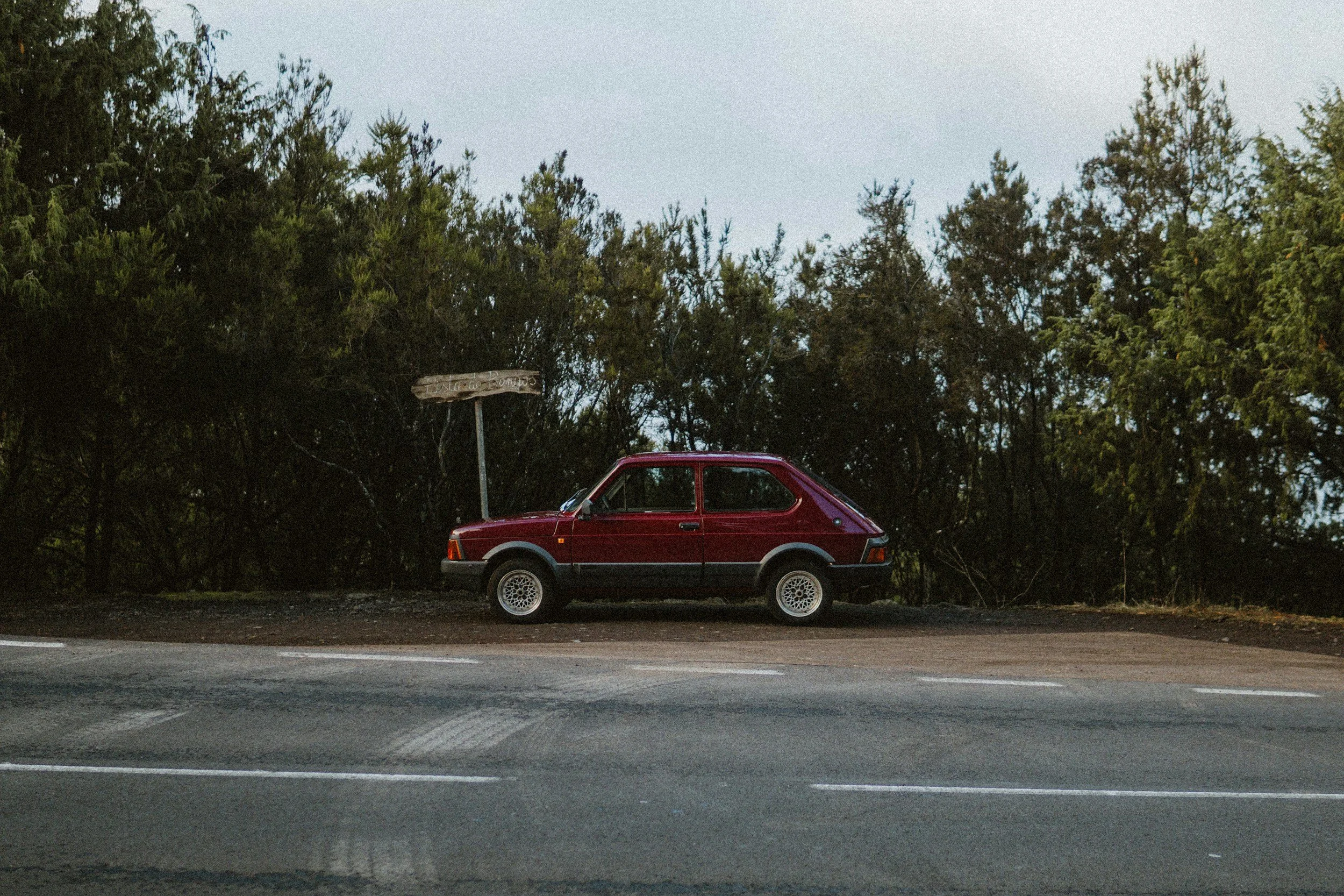 Red Car on the Side of the Road