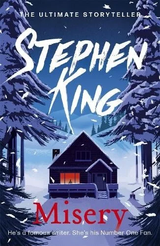 Book cover of 'Misery' by Stephen King, featuring a snowy winter scene with a house surrounded by trees and snow-covered ground.