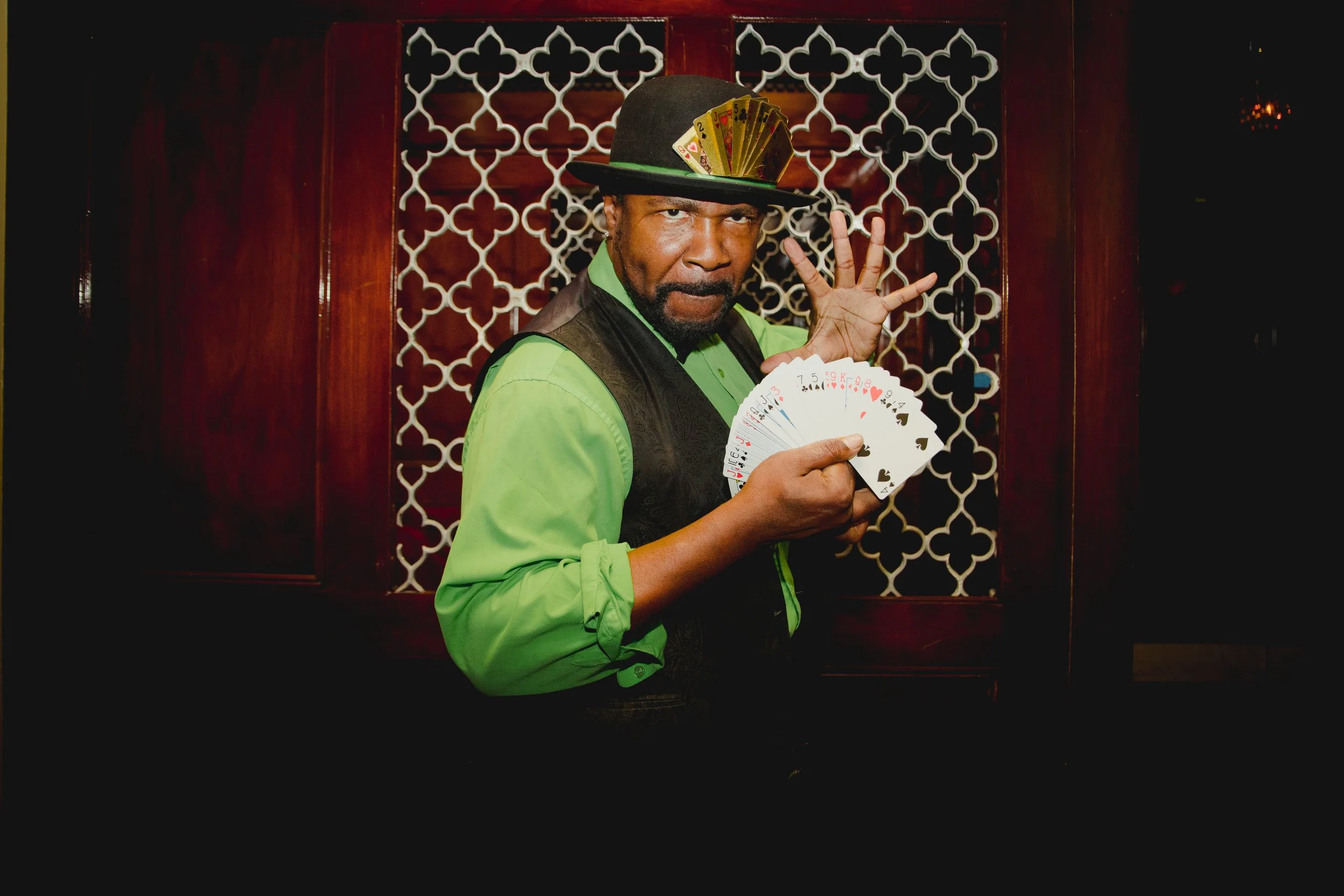 Corporate magician performing live card tricks at a company holiday party in Los Angeles. Under Raidar Events provides world-class magic entertainment for corporate events, holiday parties, and private celebrations across LA & Orange County.