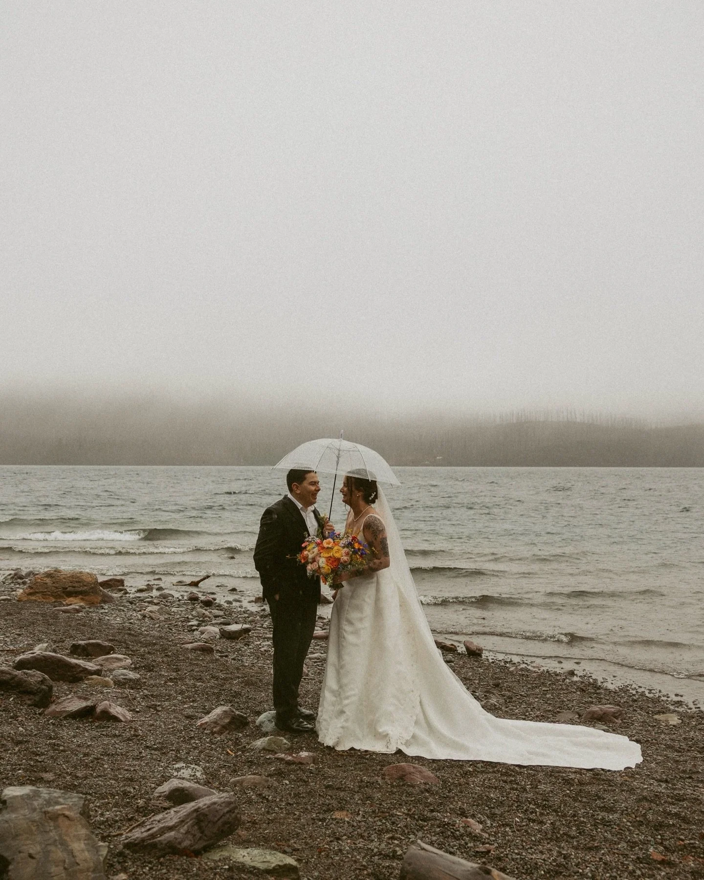 Wrapped in mist and kissed by the rain ✨ these two had the most intimate and beautiful micro wedding in Glacier National Park. I love sacred moments like these 🤍

@406officiant 
@stumptownfloral 

#glaciernationalparkwedding 
#glacierelopementphotog