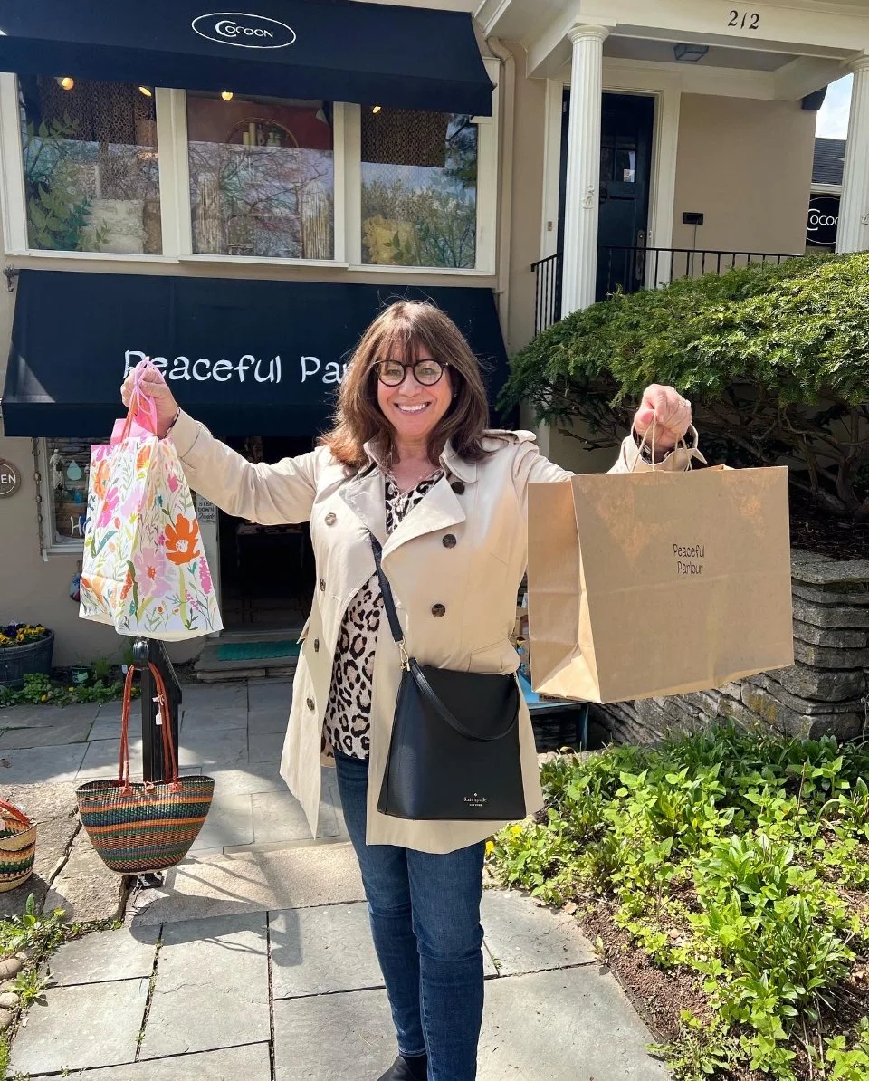 Georganne Bender Holding Shopping Bags at a Retail Tour