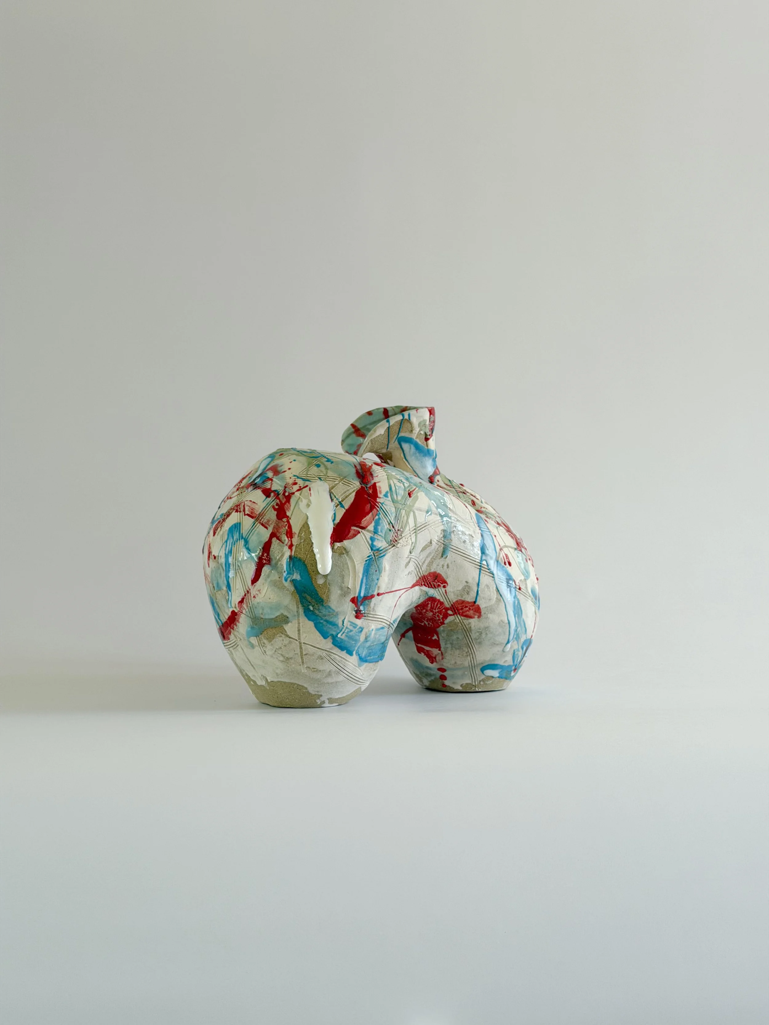 Form No. 2, with runny white glaze over red, turquoise and green and fine incised lines — sculptural ceramic vase a contemporary stoneware