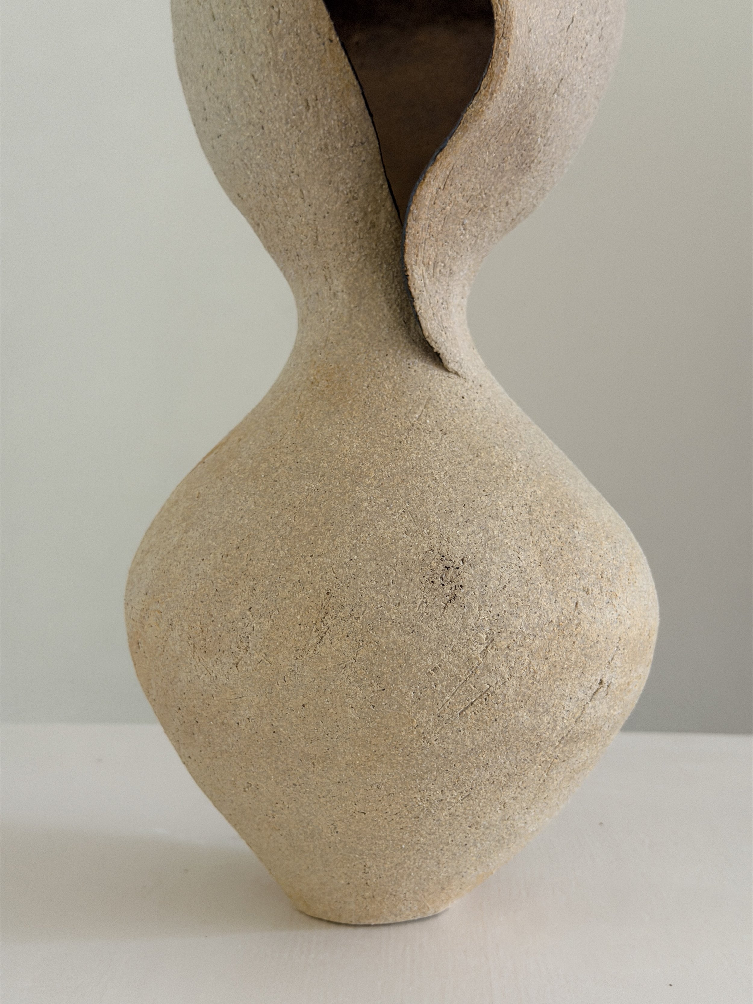 Woman 4 by Anastasia Babenko — in the form of a woman at rest, soft and full, in warm beige stoneware, original ceramic art for interior