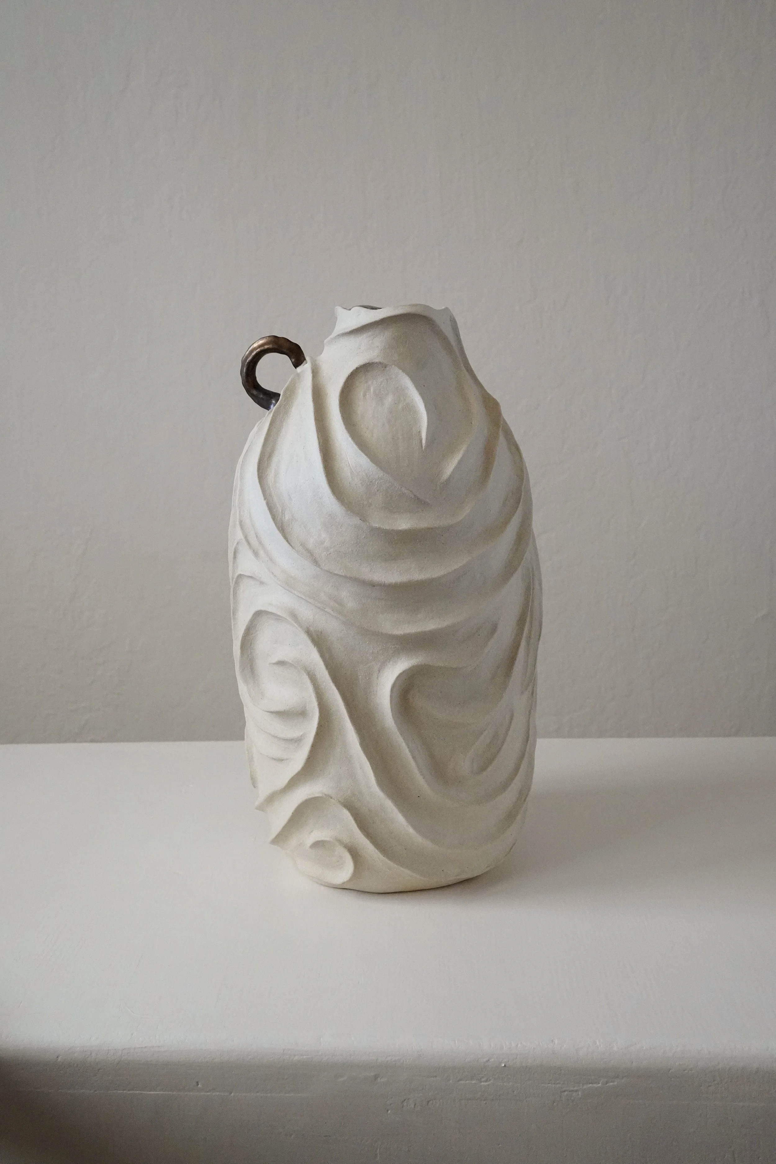 Alabaster No. 1 — hand-built ceramic vase carved all over with flowing, swirling relief in pale matte stoneware, by Anastasia Babenko