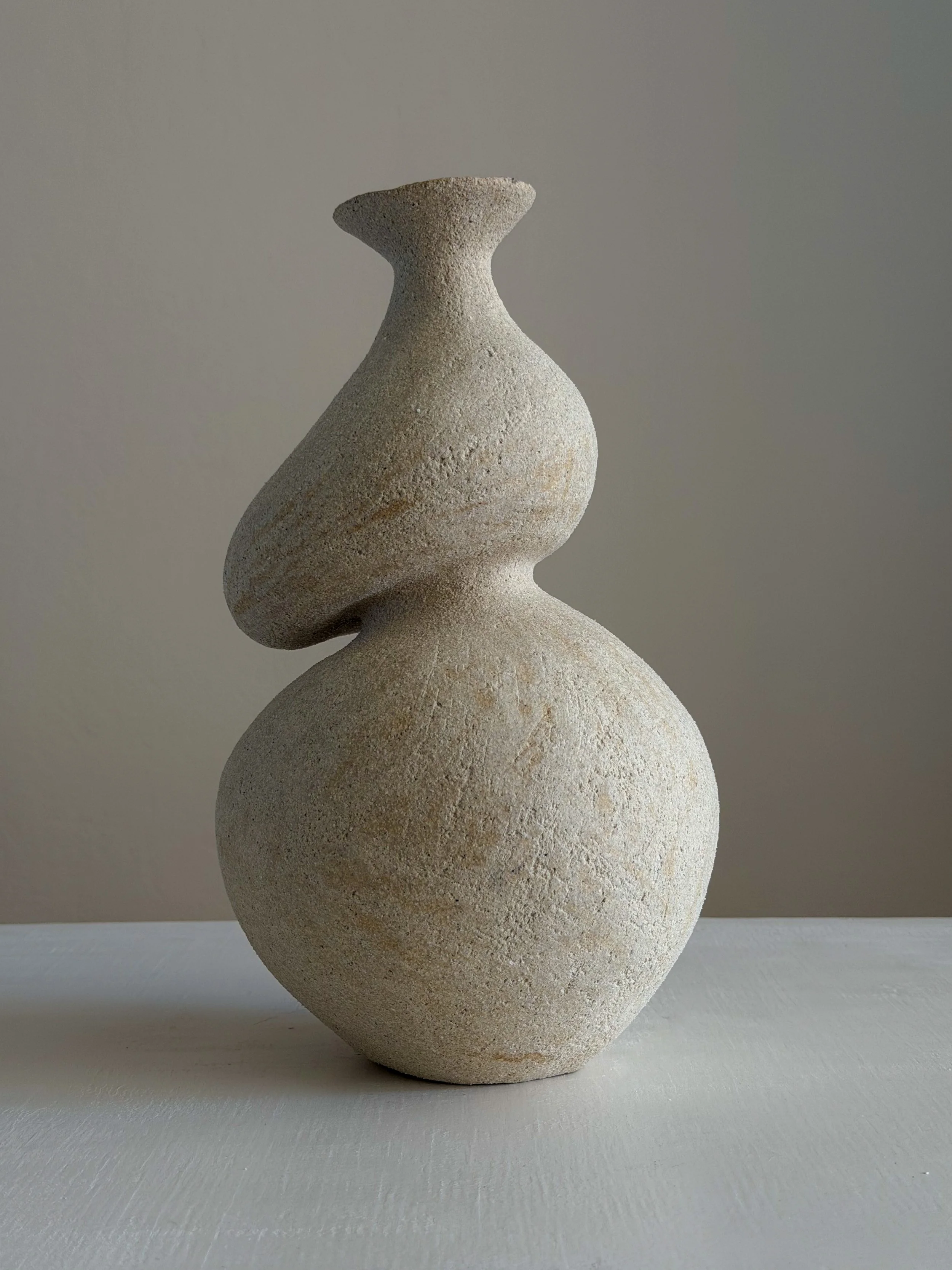 She 5 by Anastasia Babenko — in the form of a woman caught mid-turn, tilting toward a slender neck, original ceramic art for interior designers