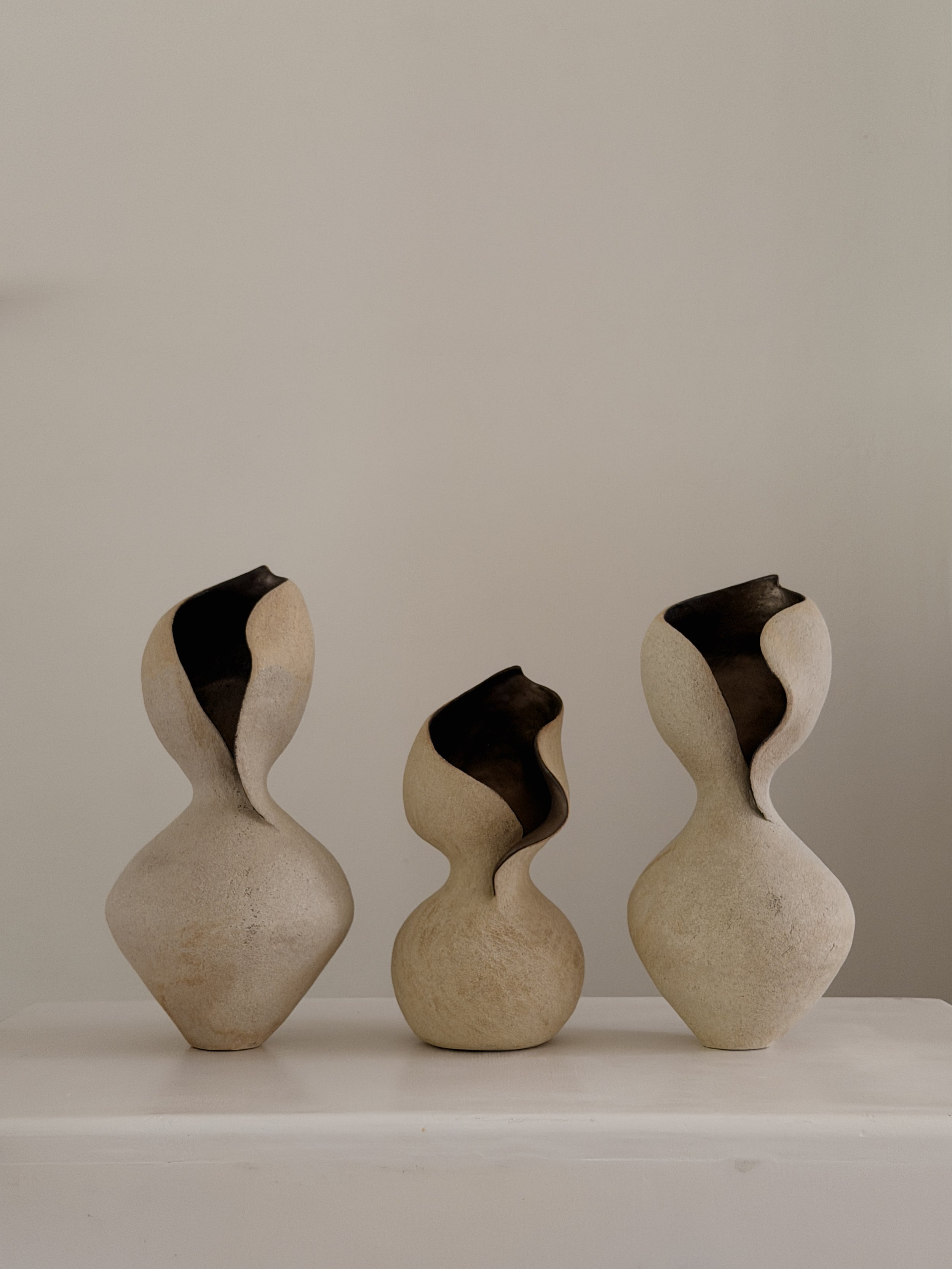Woman 4 — hand-built ceramic vase in the form of a woman at rest, soft and full, in warm beige stoneware, by Anastasia Babenko