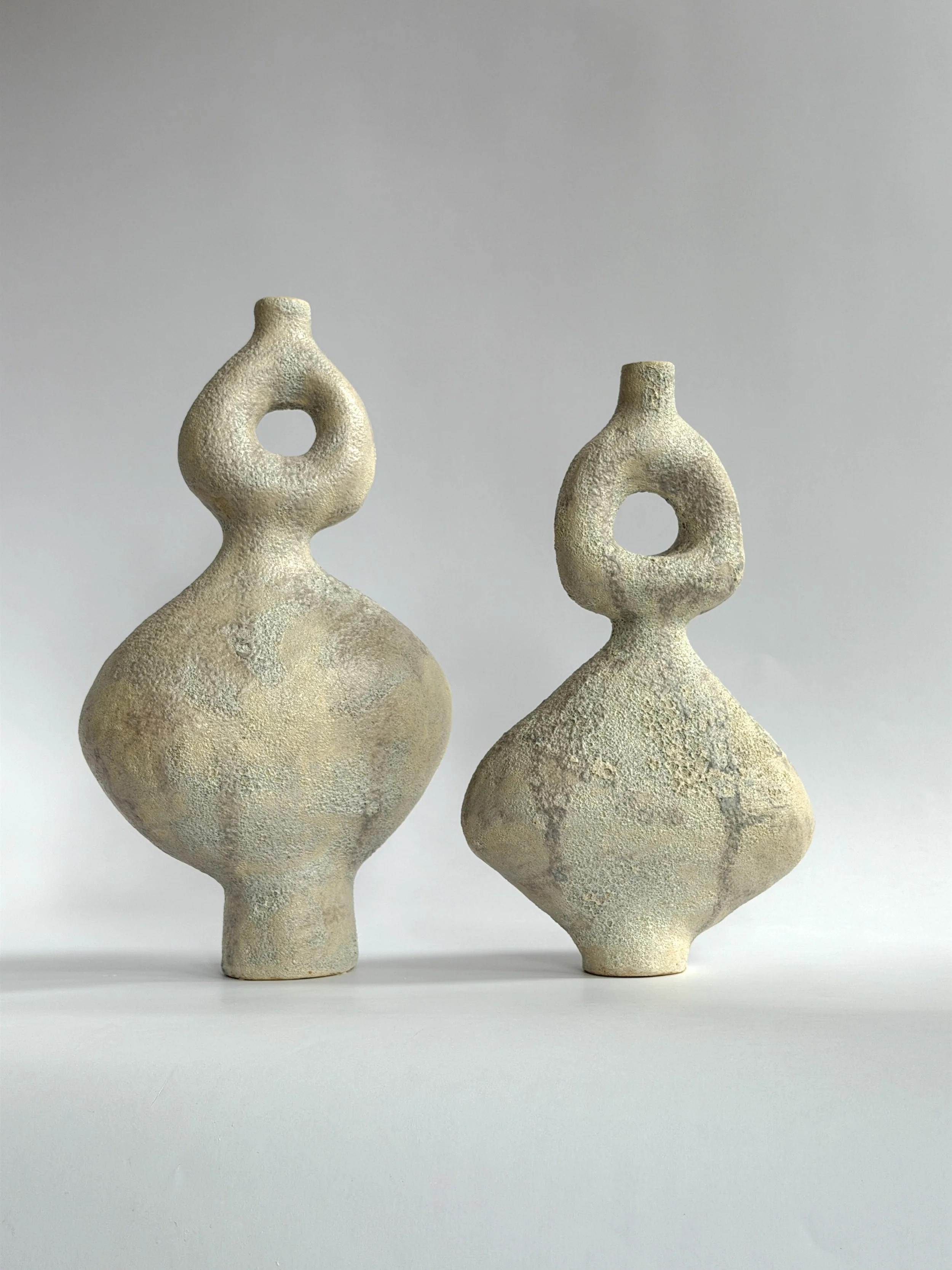 Dancers Vase Set, of rounded forms caught mid-motion, rising to looped openings — sculptural ceramic vase set sculptural decor for design-led
