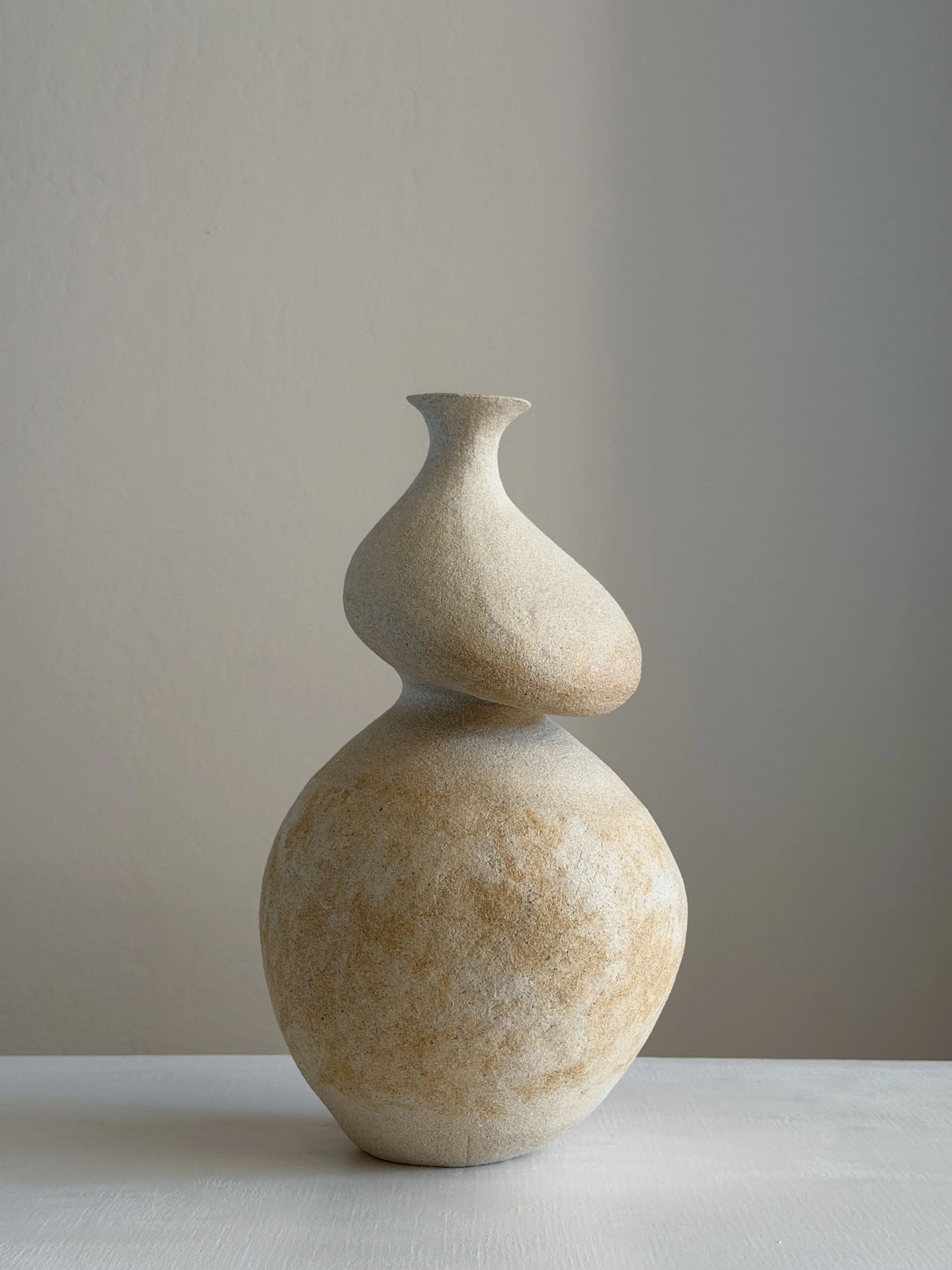 She 3 by Anastasia Babenko — in the form of a resting woman with a full, round belly and soft upper body, original ceramic art for interior