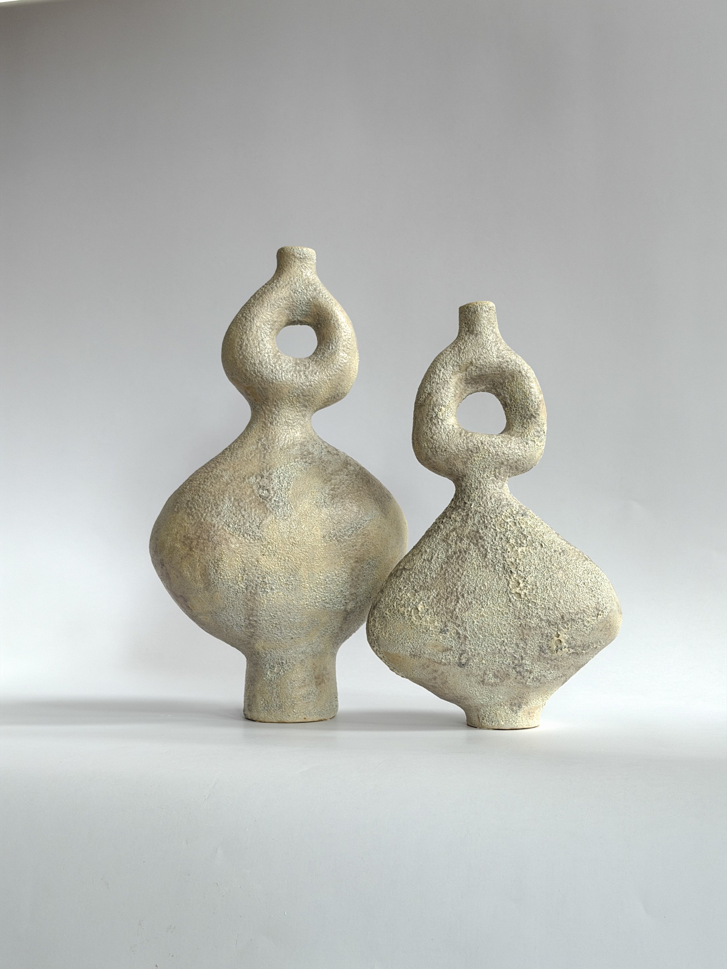 Dancers Vase Set — hand-built ceramic vase set of rounded forms caught mid-motion, rising to looped openings, by Anastasia Babenko