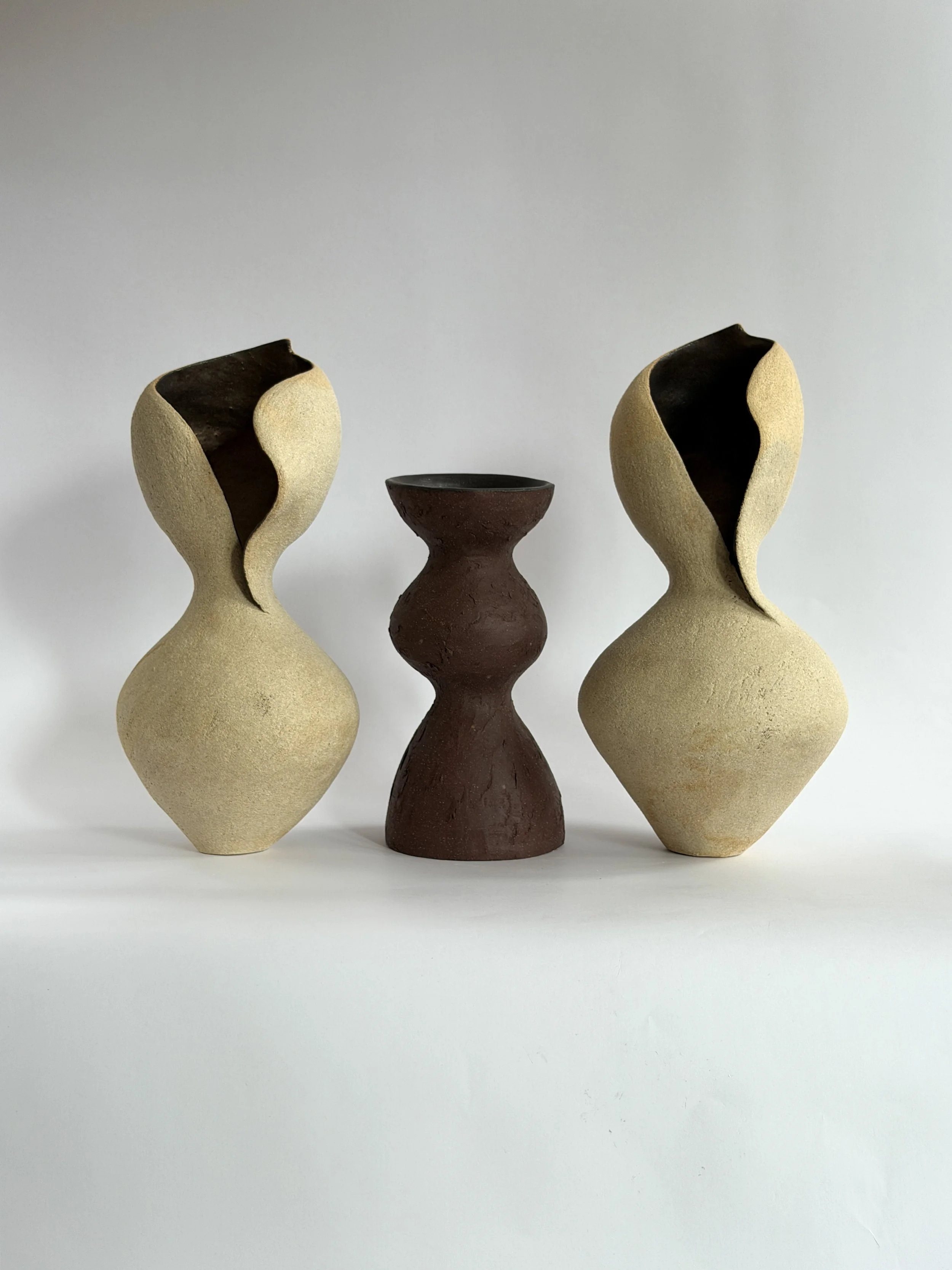 Woman 4 by Anastasia Babenko — in the form of a woman at rest, soft and full, in warm beige stoneware, sculptural decor for design-led spaces
