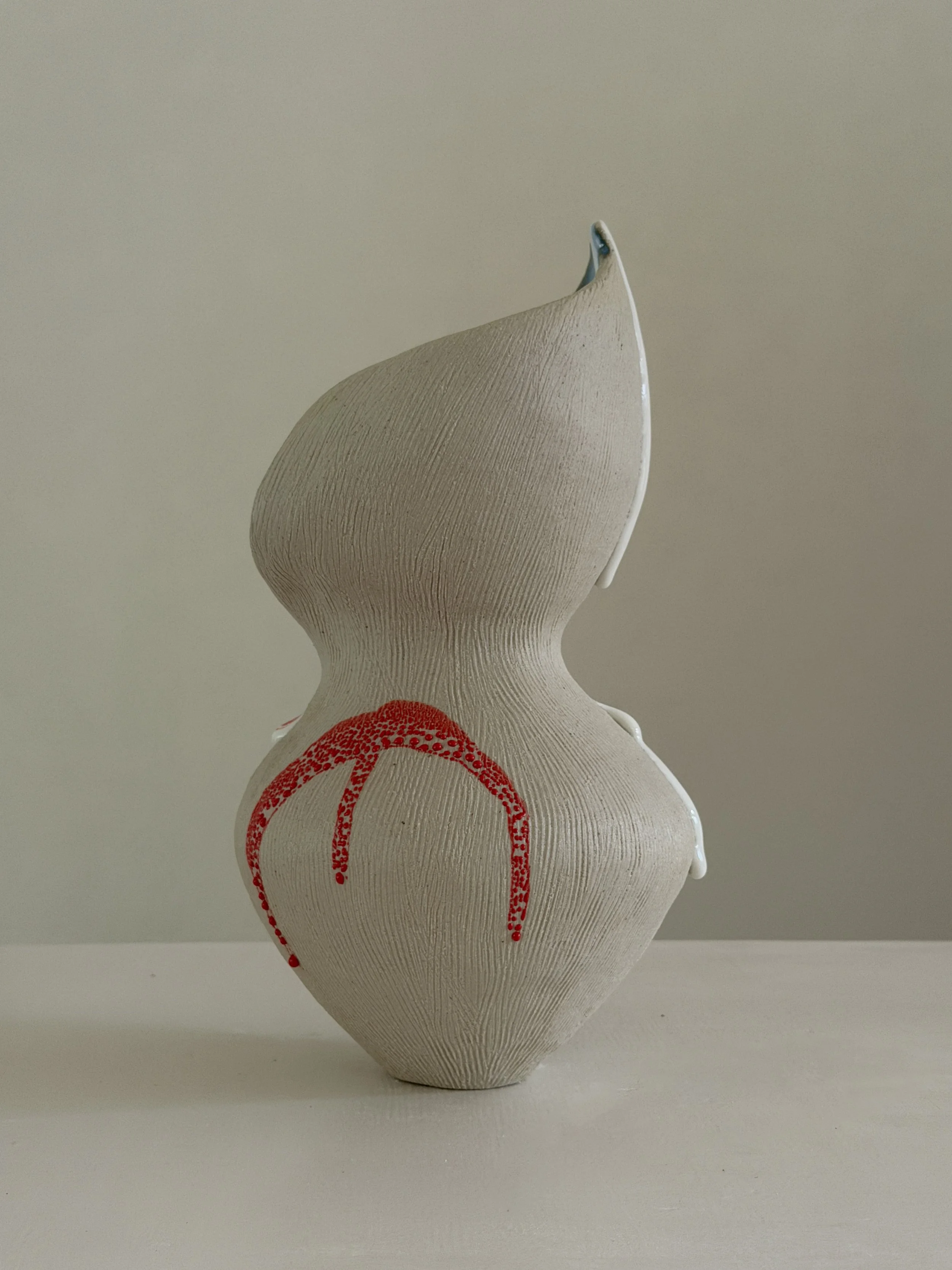 She 6, in the form of a resting woman, soft and full — sculptural ceramic vase made for considered, organic interiors