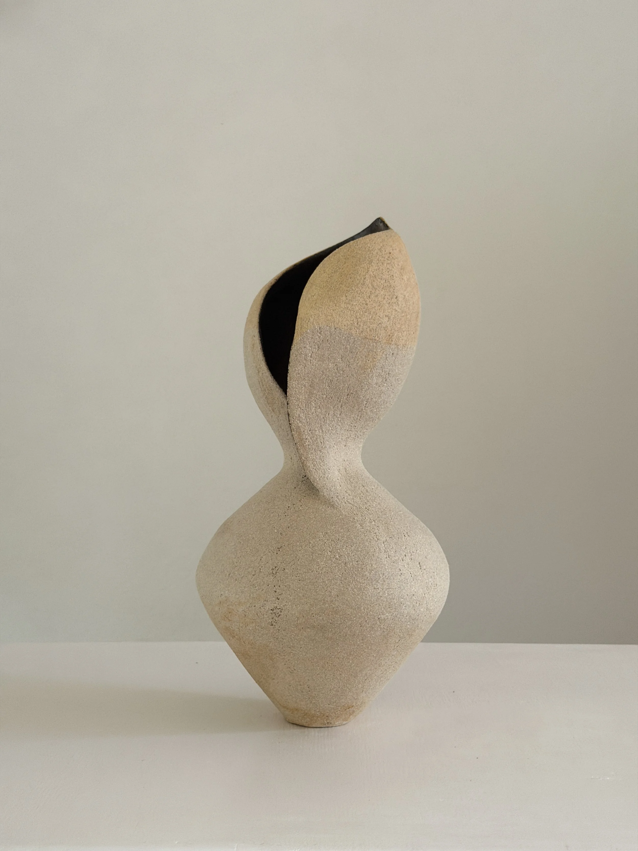 Woman 4: in the form of a woman at rest, soft and full, in warm beige stoneware, a sculptural ceramic vase by Anastasia Babenko