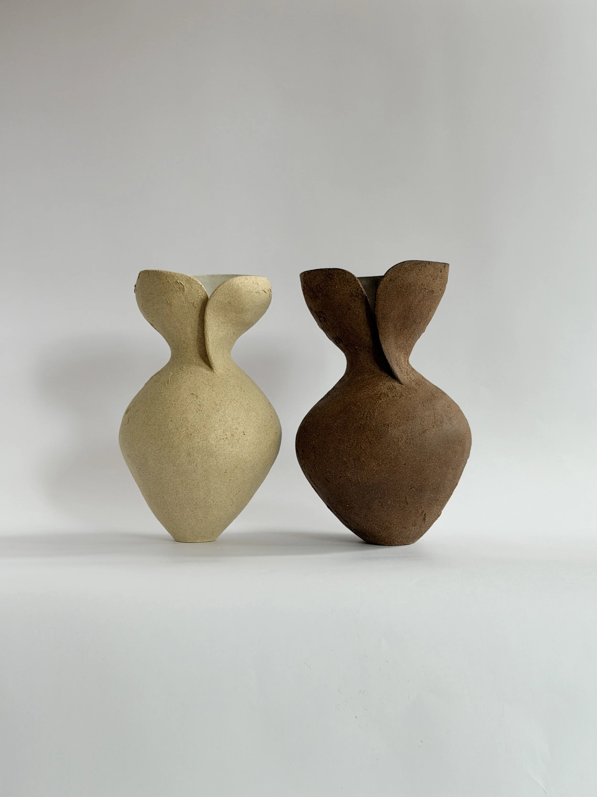 Silhouette Vase in Beige: tracing a woman's full, rounded silhouette in beige stoneware, a sculptural ceramic vase by Anastasia Babenko