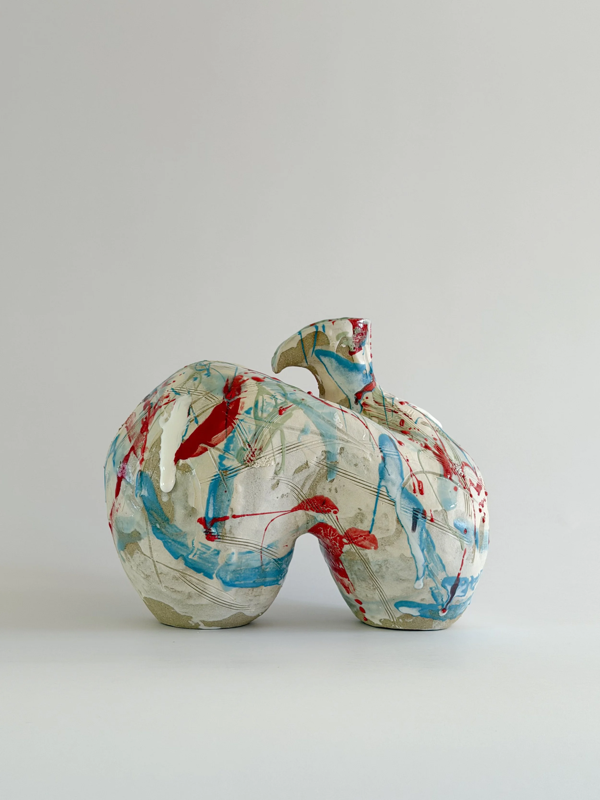 Form No. 2 — hand-built ceramic vase with runny white glaze over red, turquoise and green and fine incised lines, by Anastasia Babenko