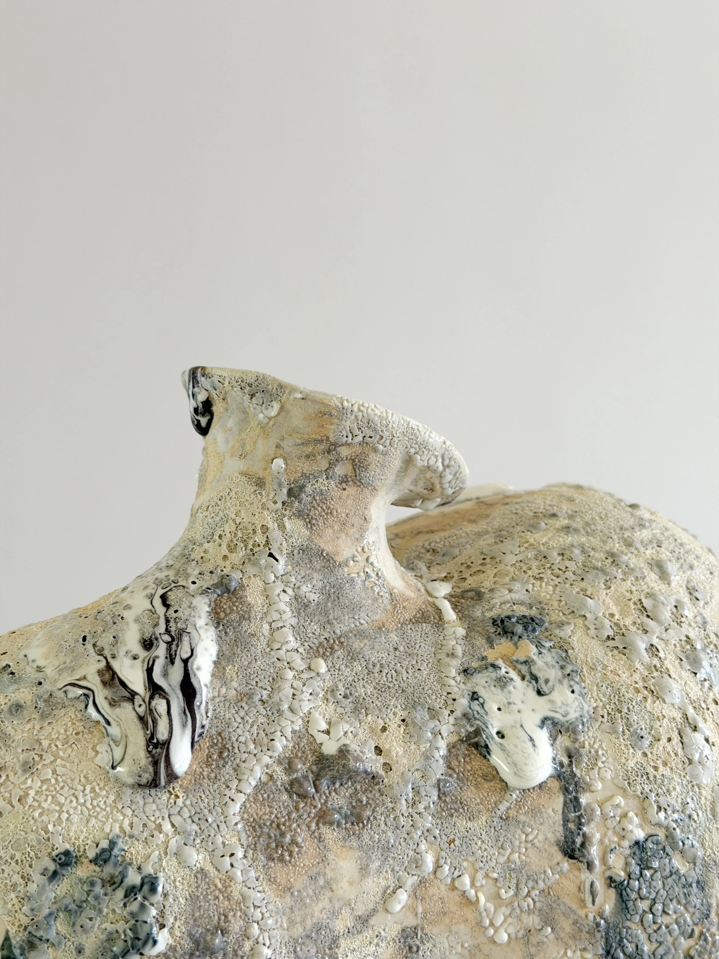 Form No. 1, with two full volumes resting under a crawling, sand-colored mineral crust — sculptural ceramic vase a contemporary stoneware