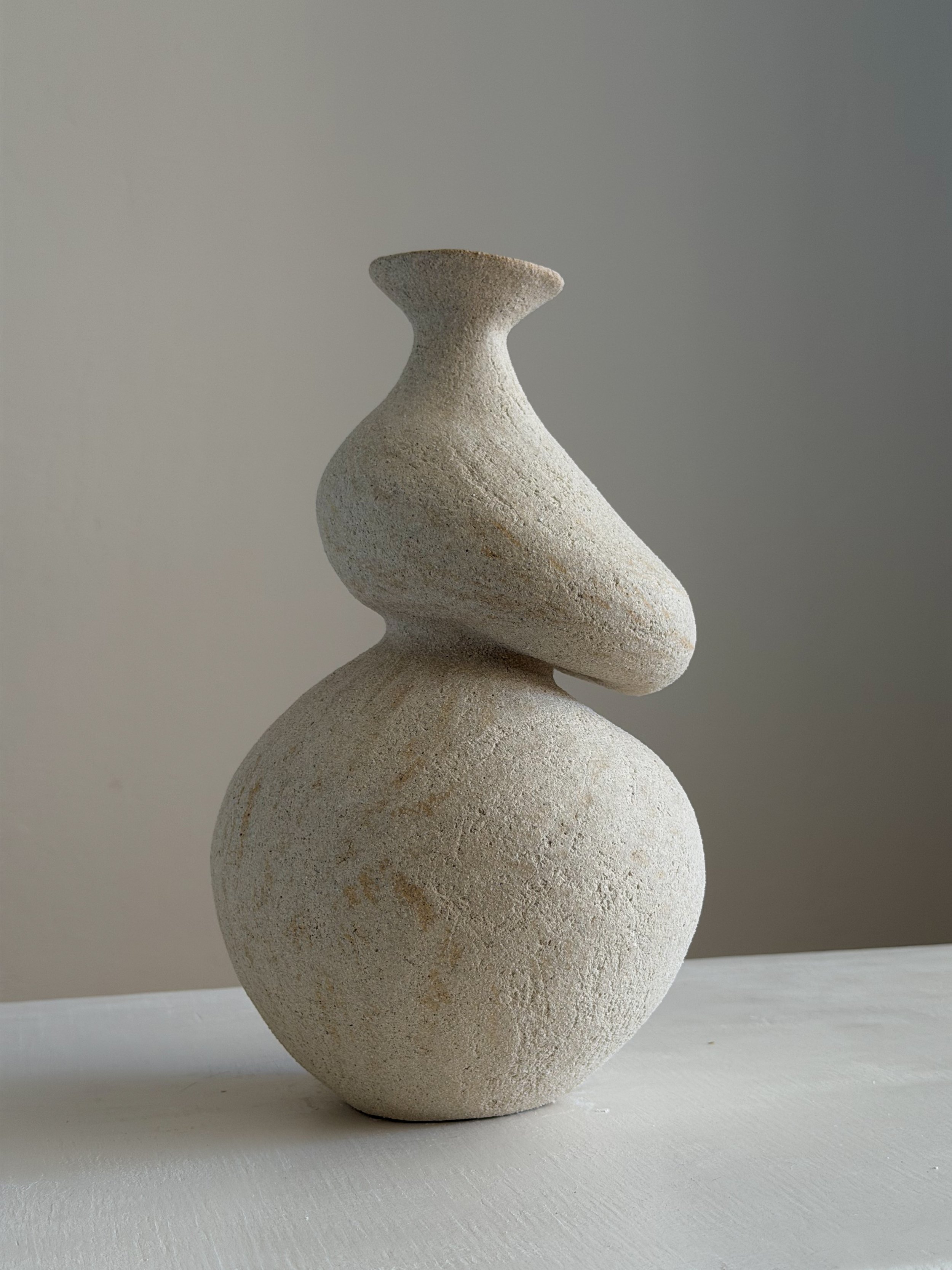 Hand-built ceramic vase: She 5, in the form of a woman caught mid-turn, tilting toward a slender neck — Anastasia Babenko