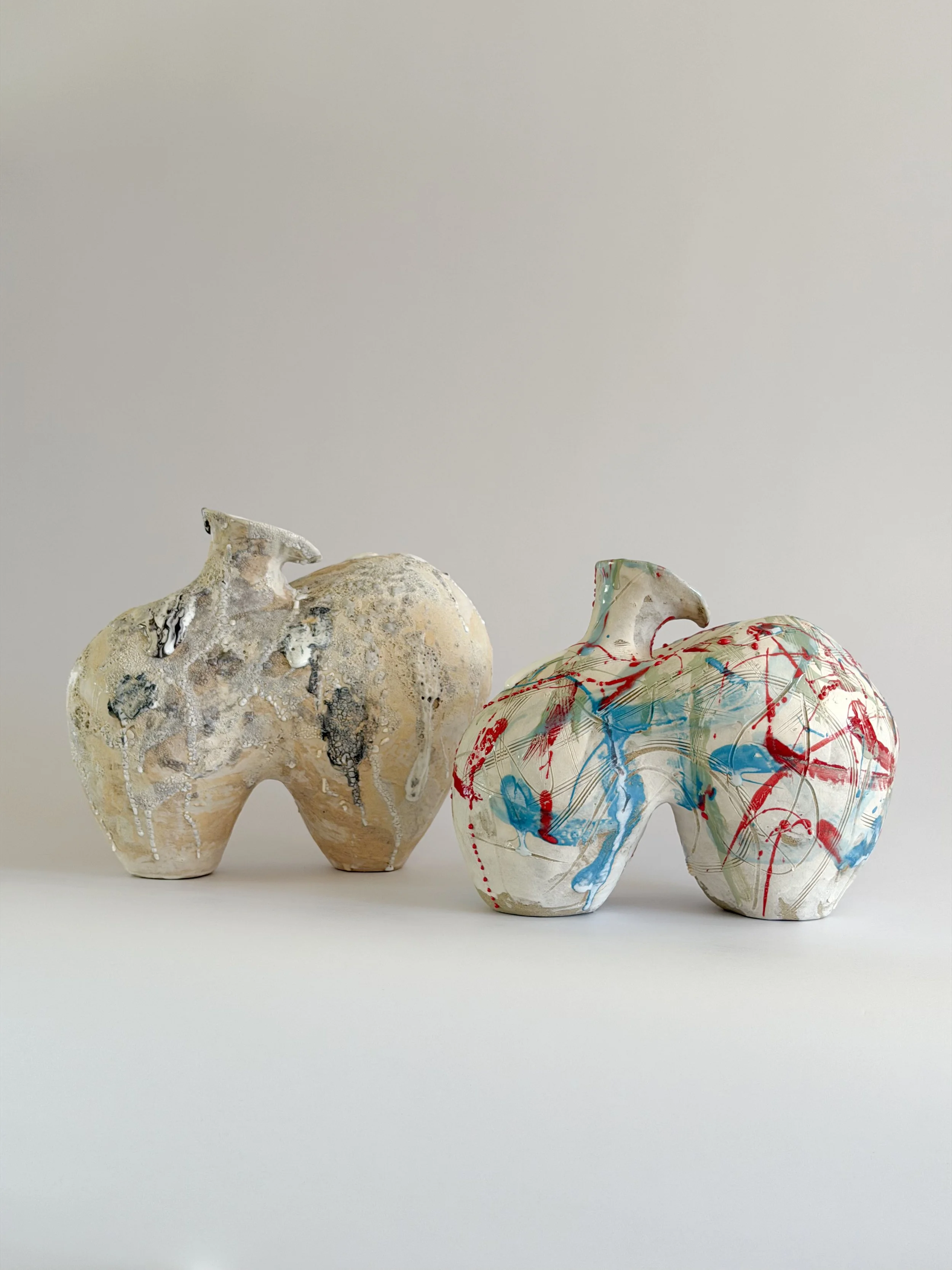 Form No. 1: with two full volumes resting under a crawling, sand-colored mineral crust, a sculptural ceramic vase by Anastasia Babenko